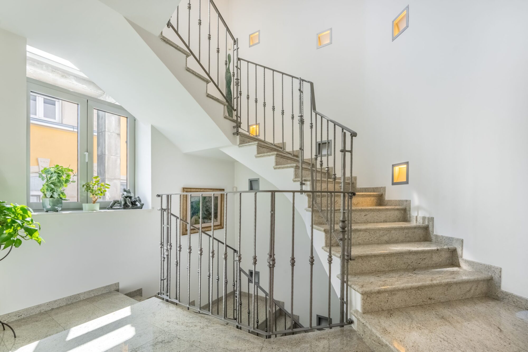 Elegant staircase with wrought iron railing