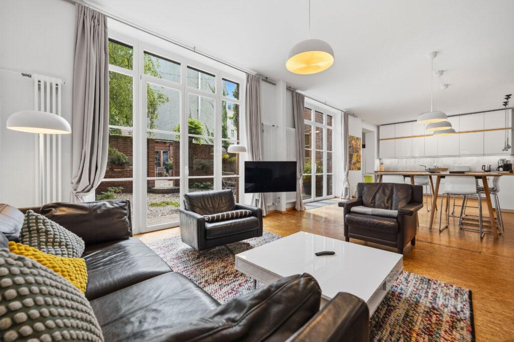 Living room with leather sofas and dining area view