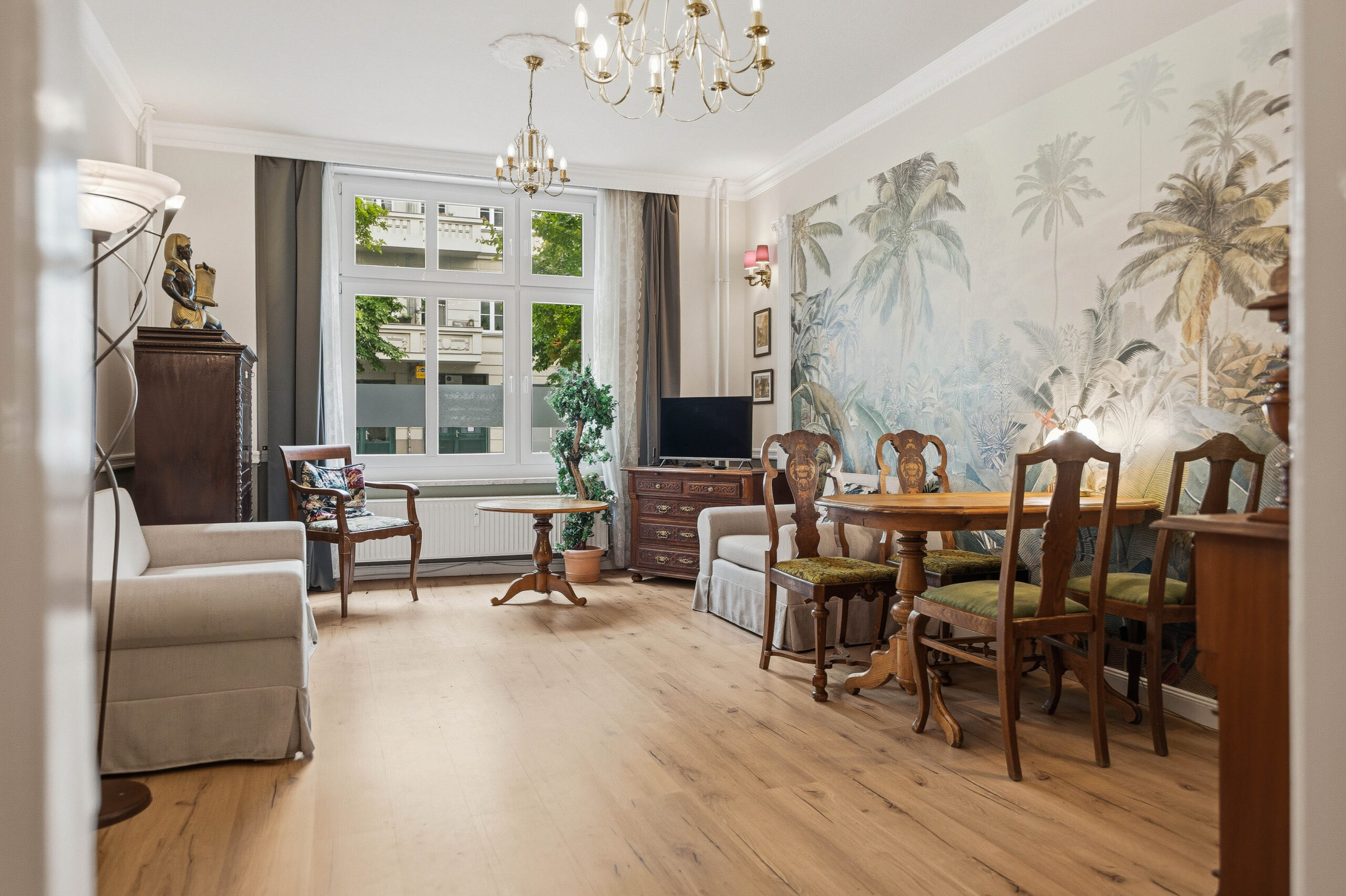 Spacious living and dining room with mural wall