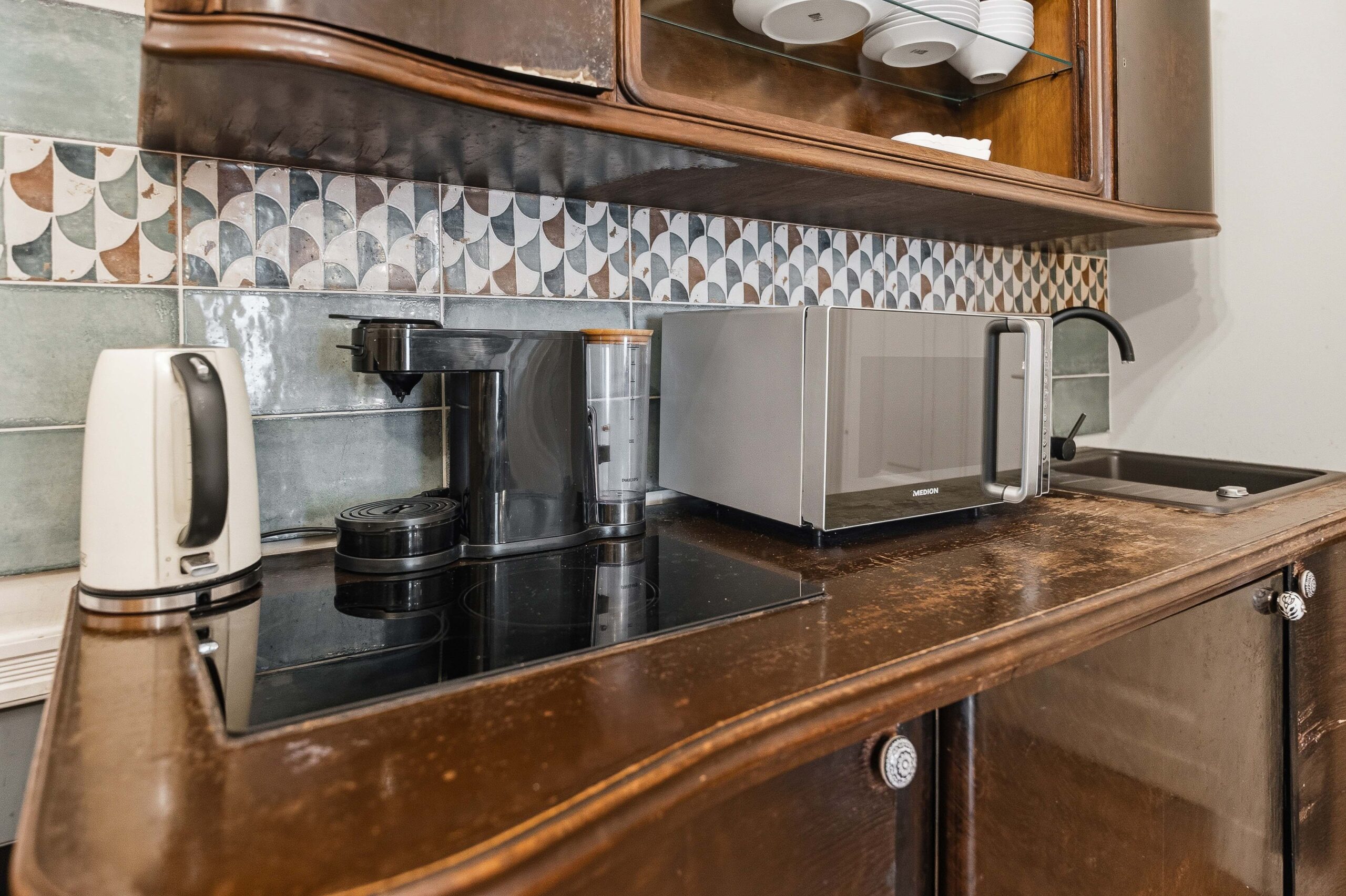 Kitchen counter with appliances and backsplash