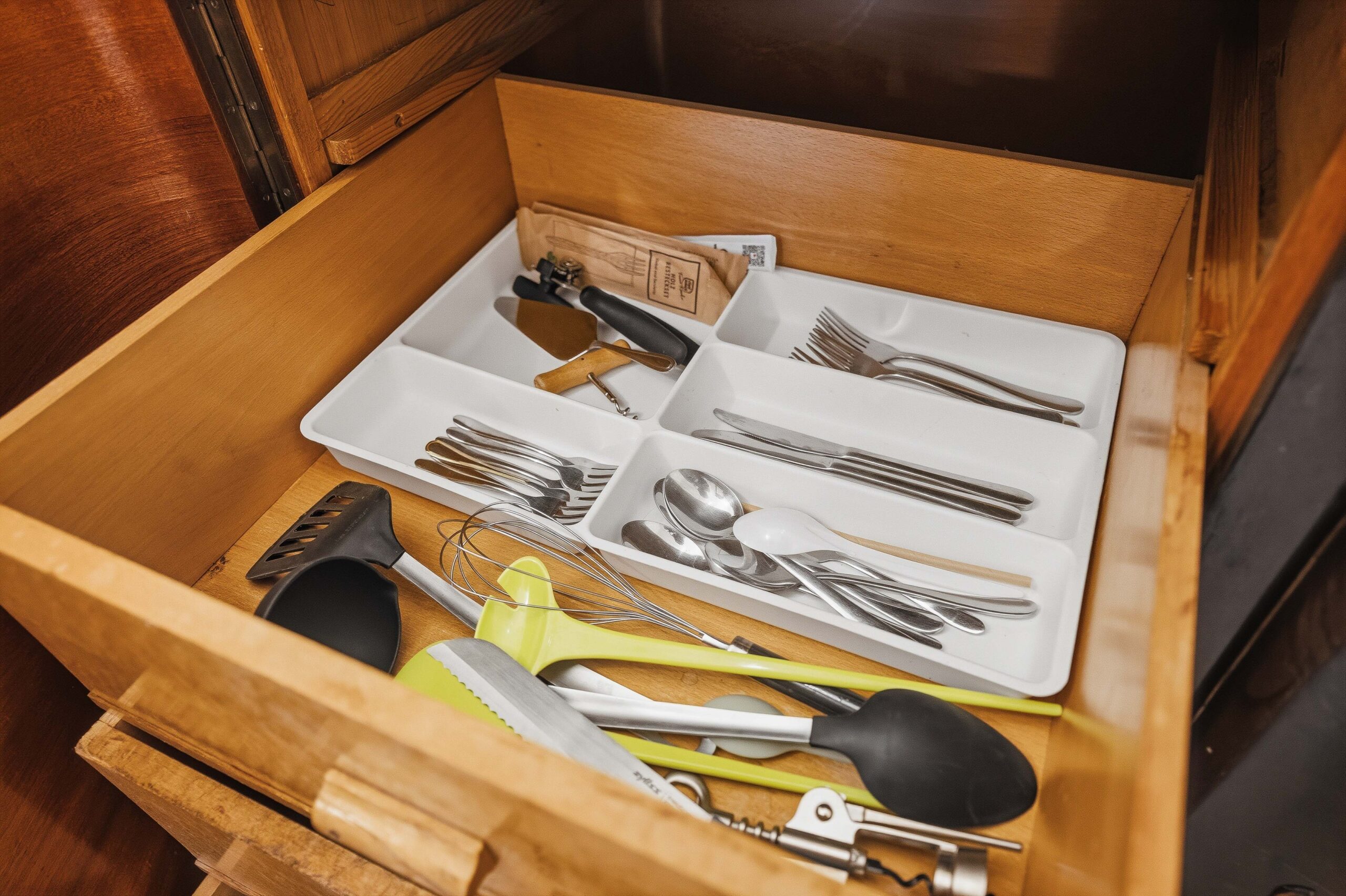 Drawer with organized cutlery and utensils
