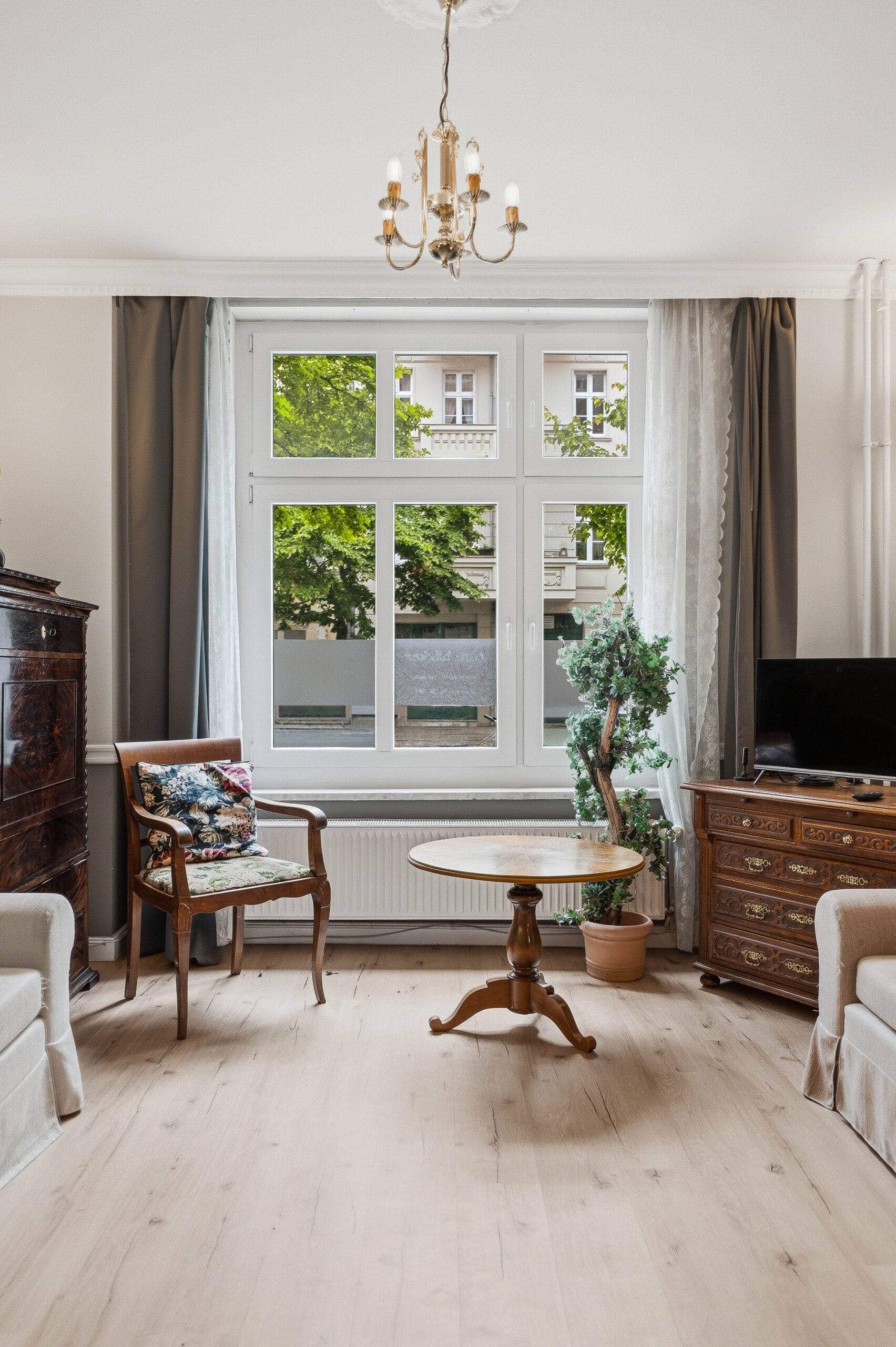 Seating area with antique chair and round table