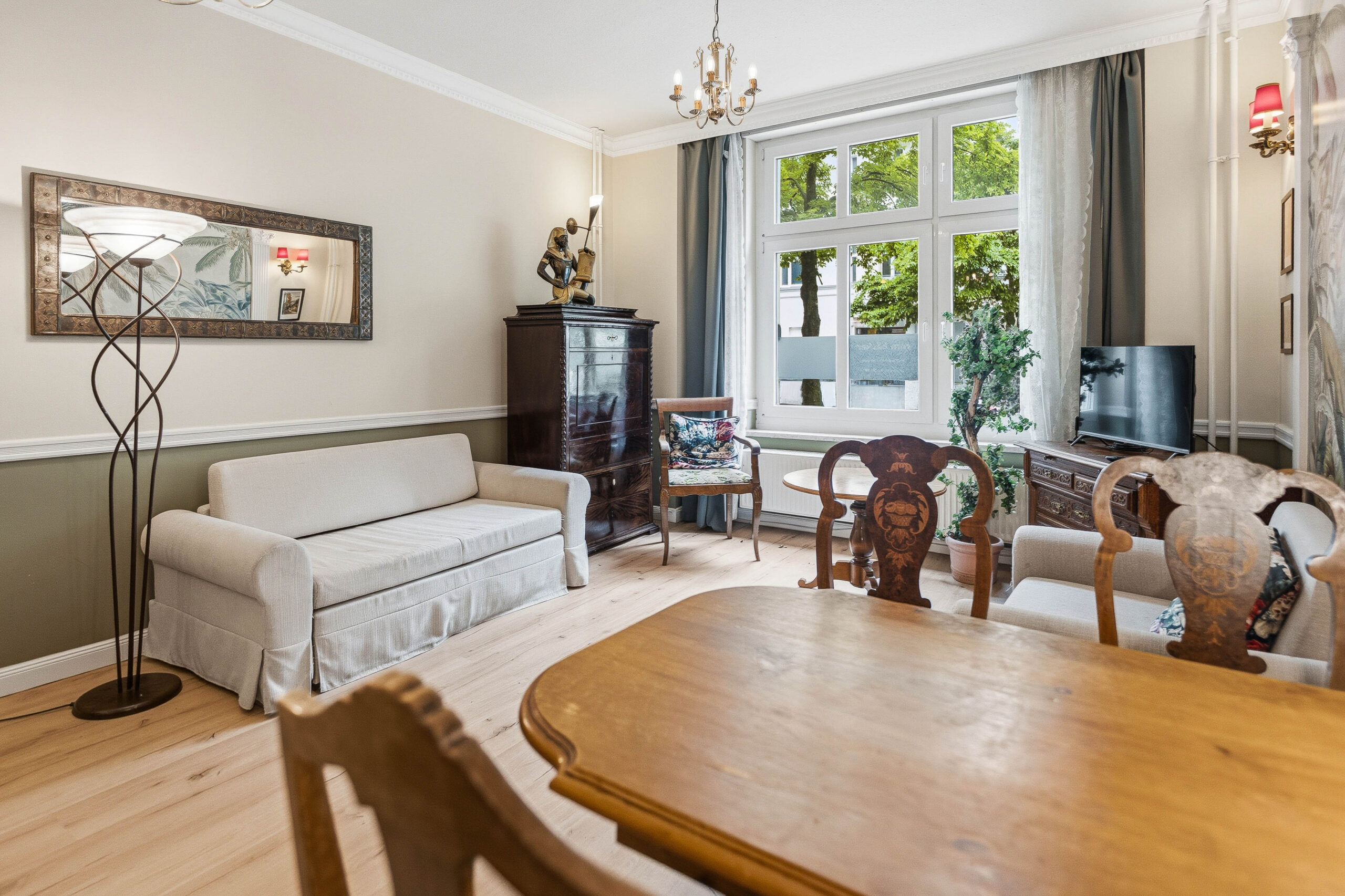 Living room with sofa, chairs and dining table