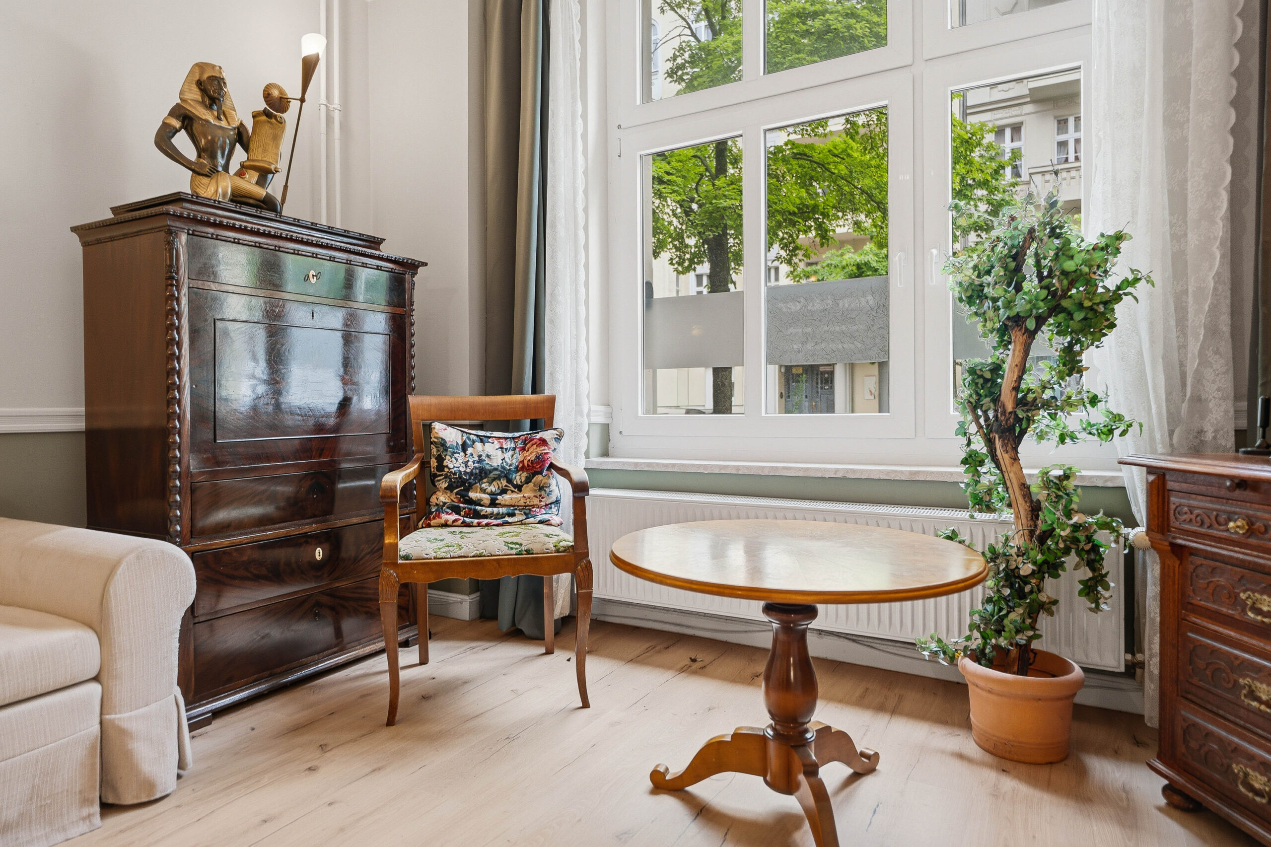 Corner with antique cabinet, chair and round table