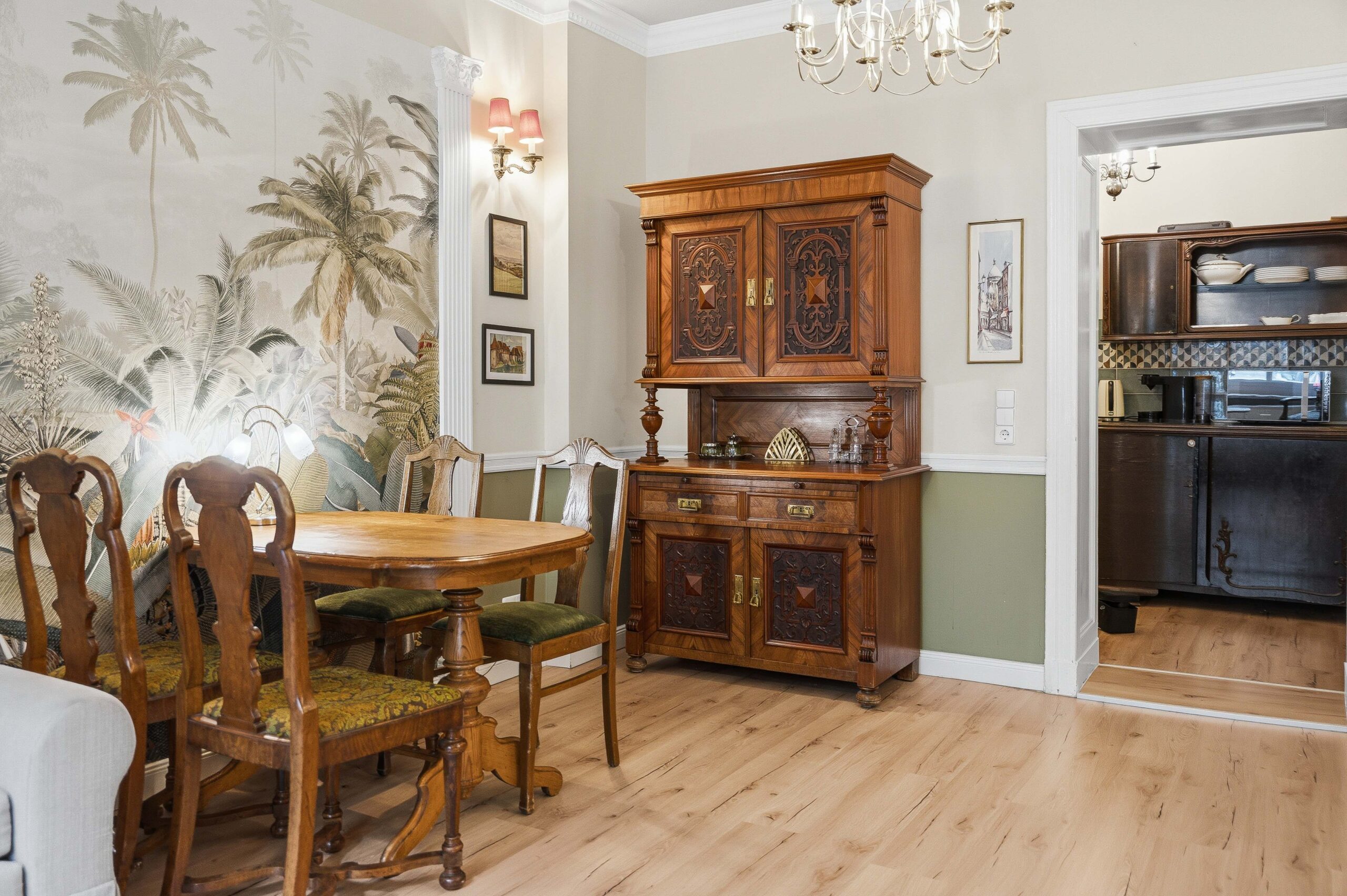 Dining room with wooden cabinet and kitchen view