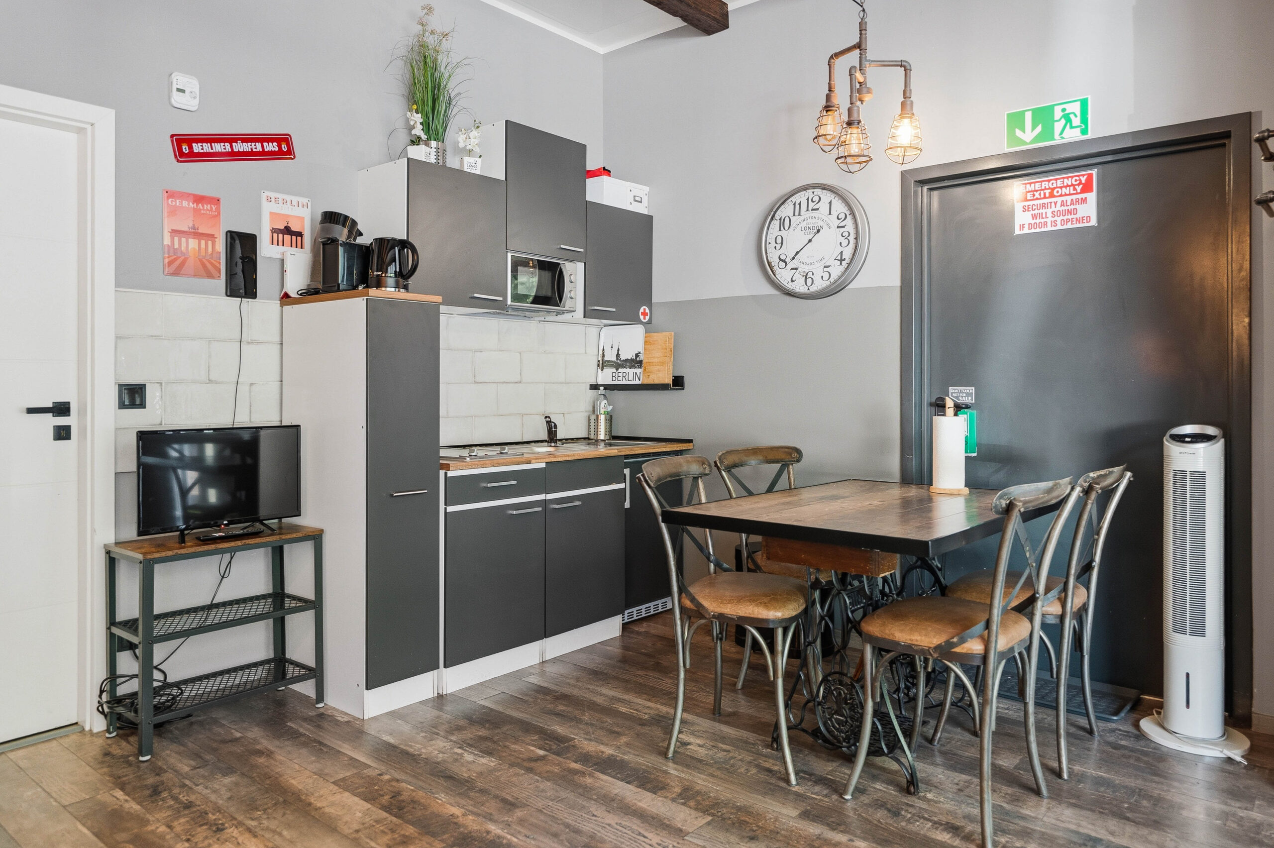 Kitchen and dining area with wooden table and chairs