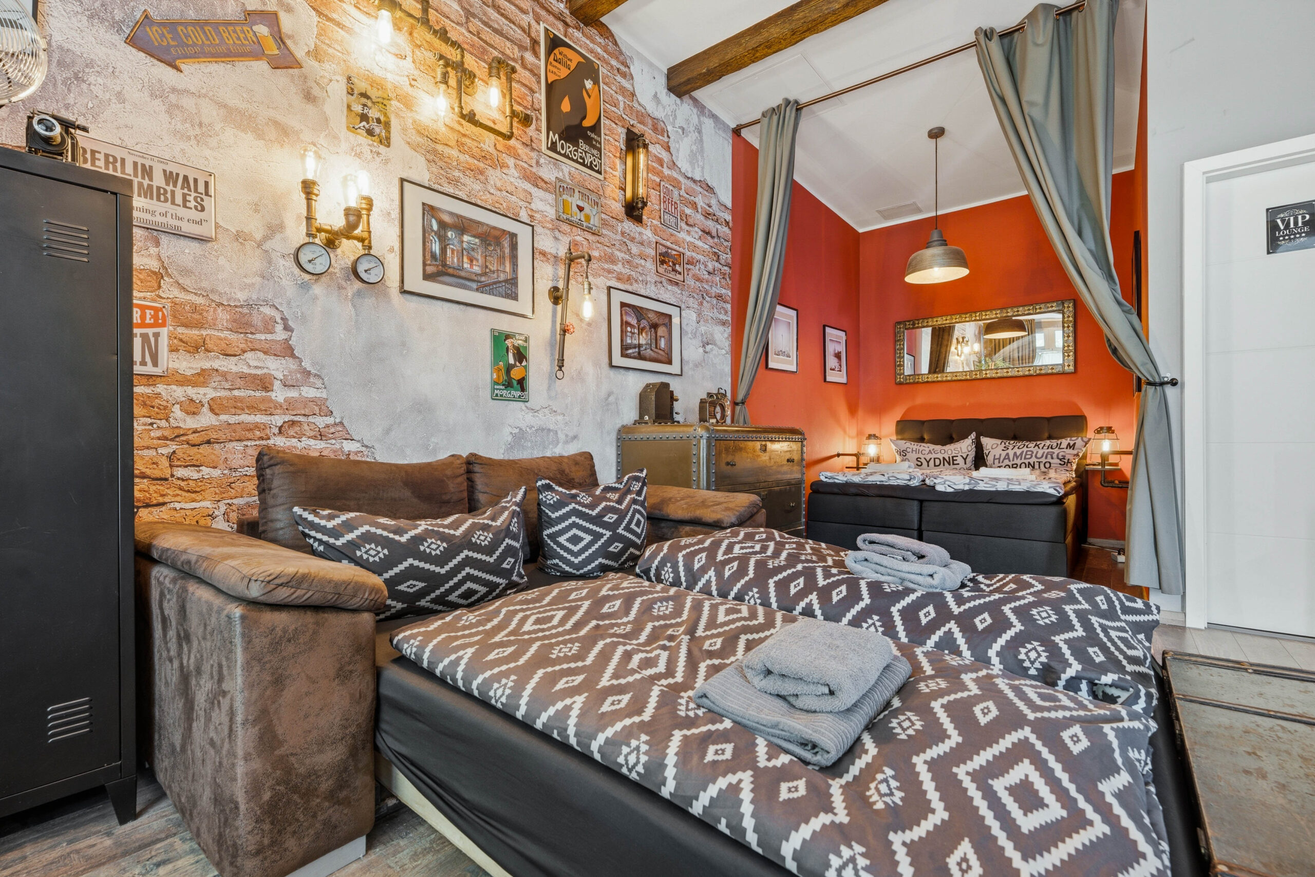 Bedroom with brick wall and geometric bedding