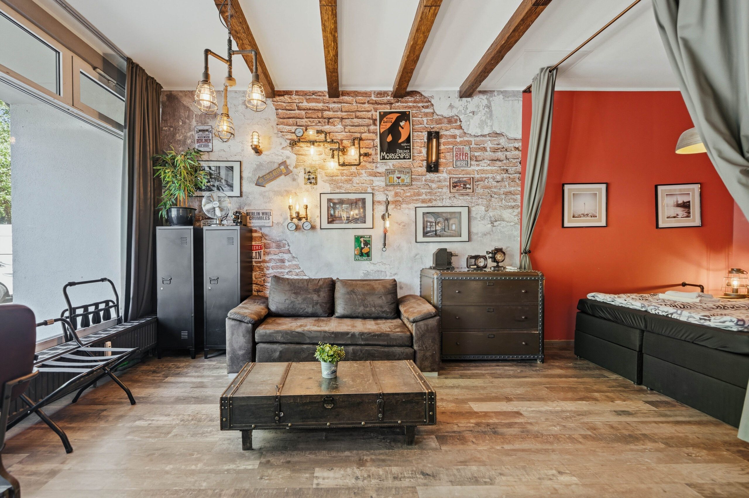 Industrial living room with exposed brick and leather sofa