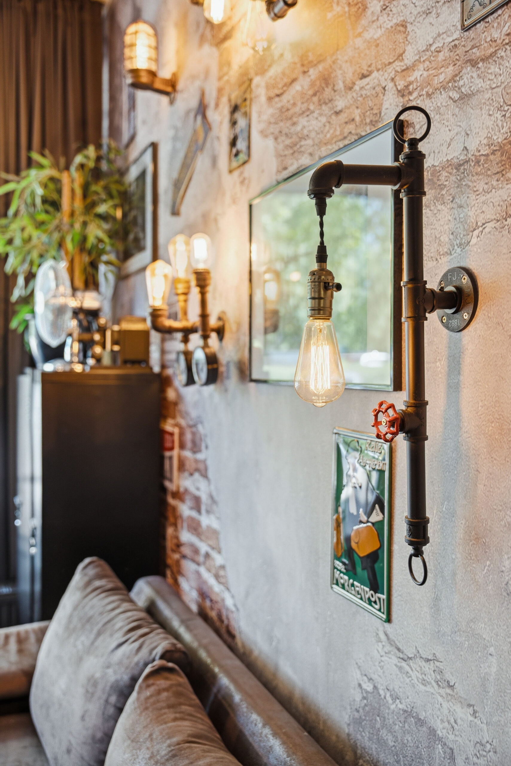 Industrial pipe lamp fixture on textured wall