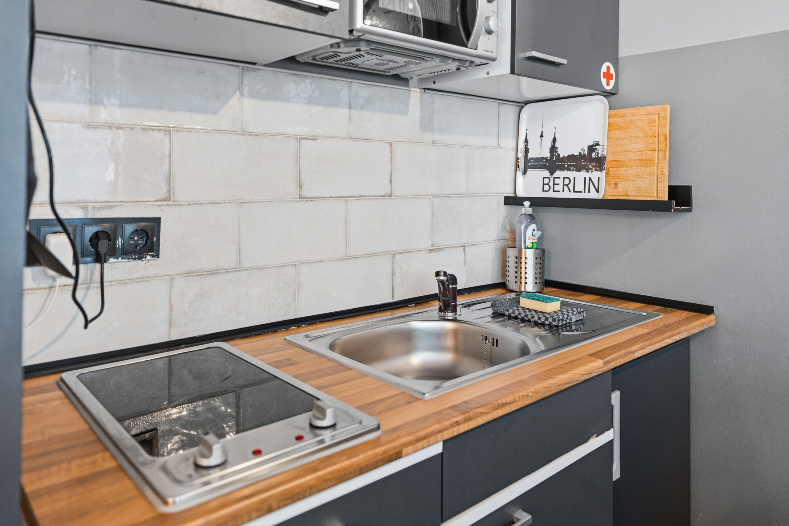 Kitchen counter with sink and stovetop
