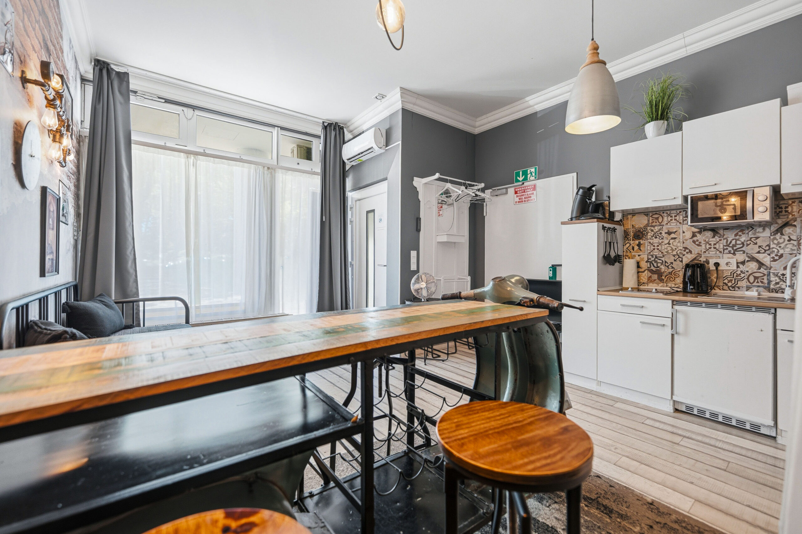 Kitchen with wooden table and bar stools