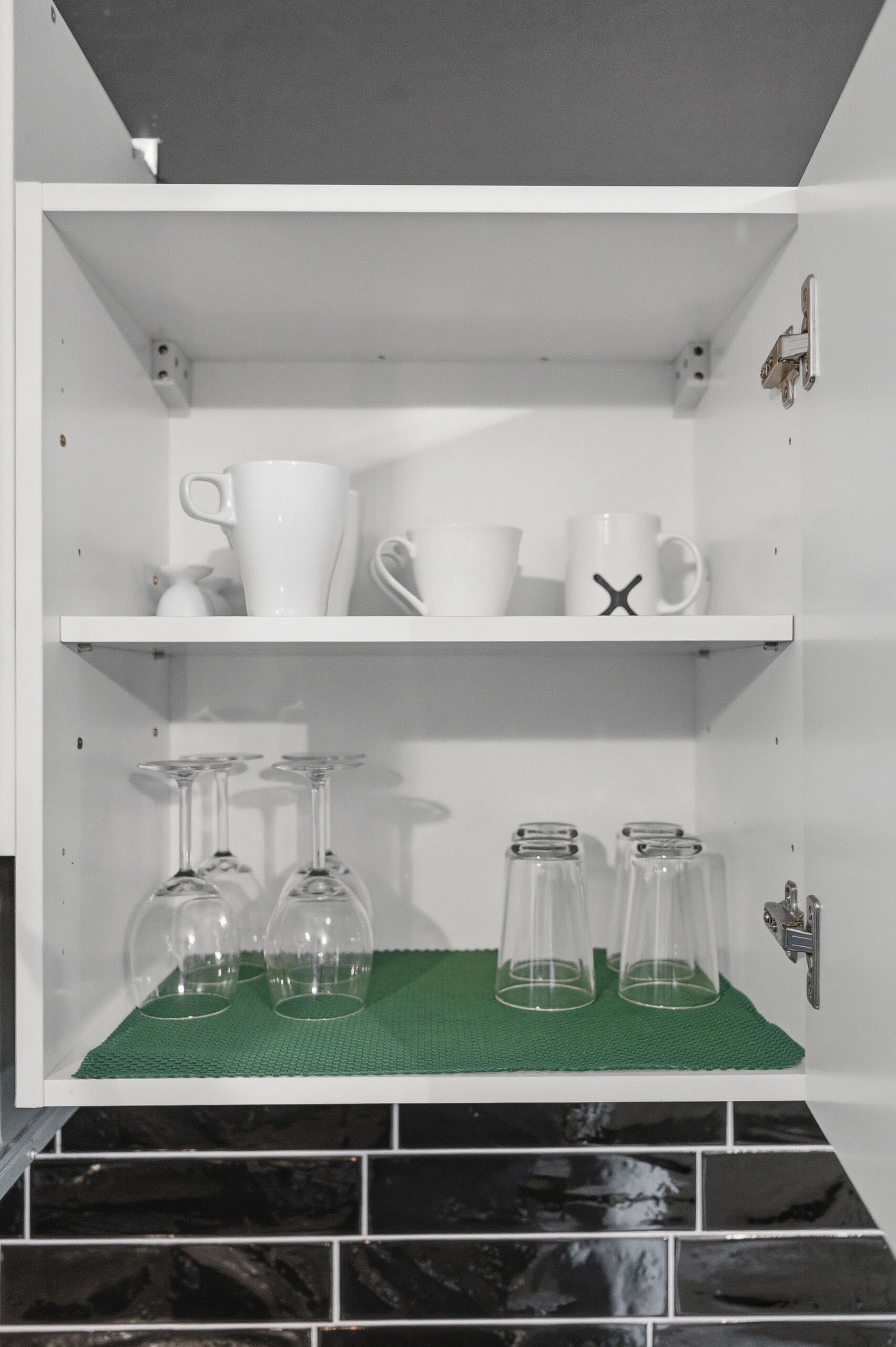 Cabinet shelf with mugs and glassware