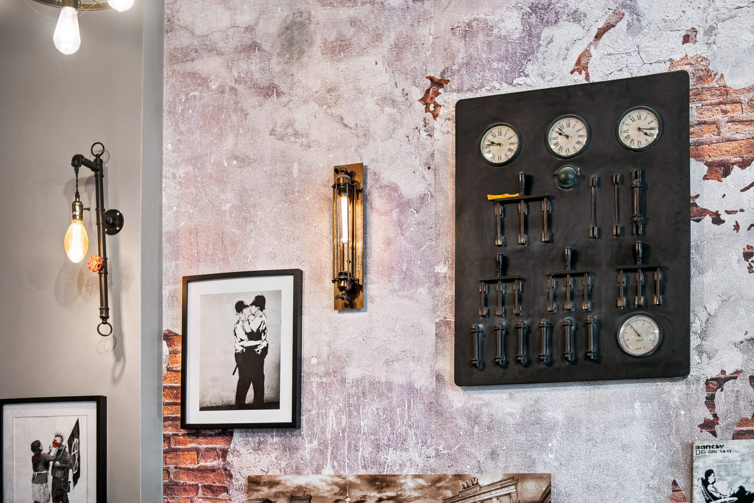 Wall art display with industrial wall mount and framed prints