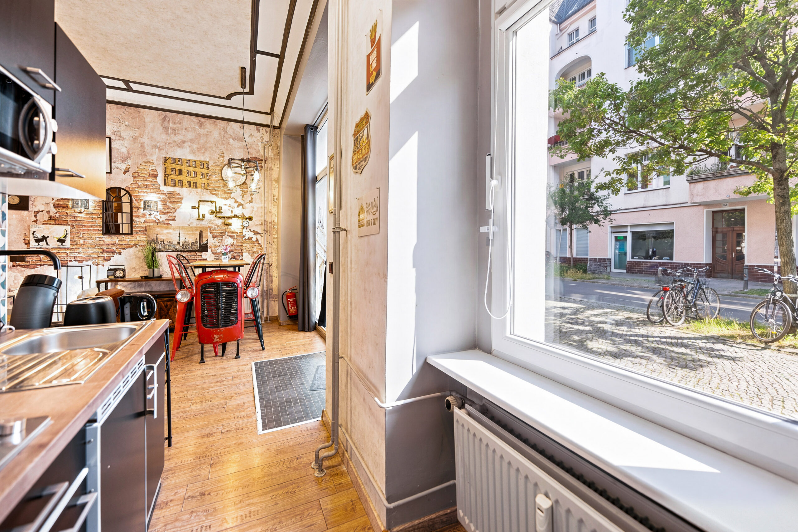 Narrow kitchen with wooden counters and street view