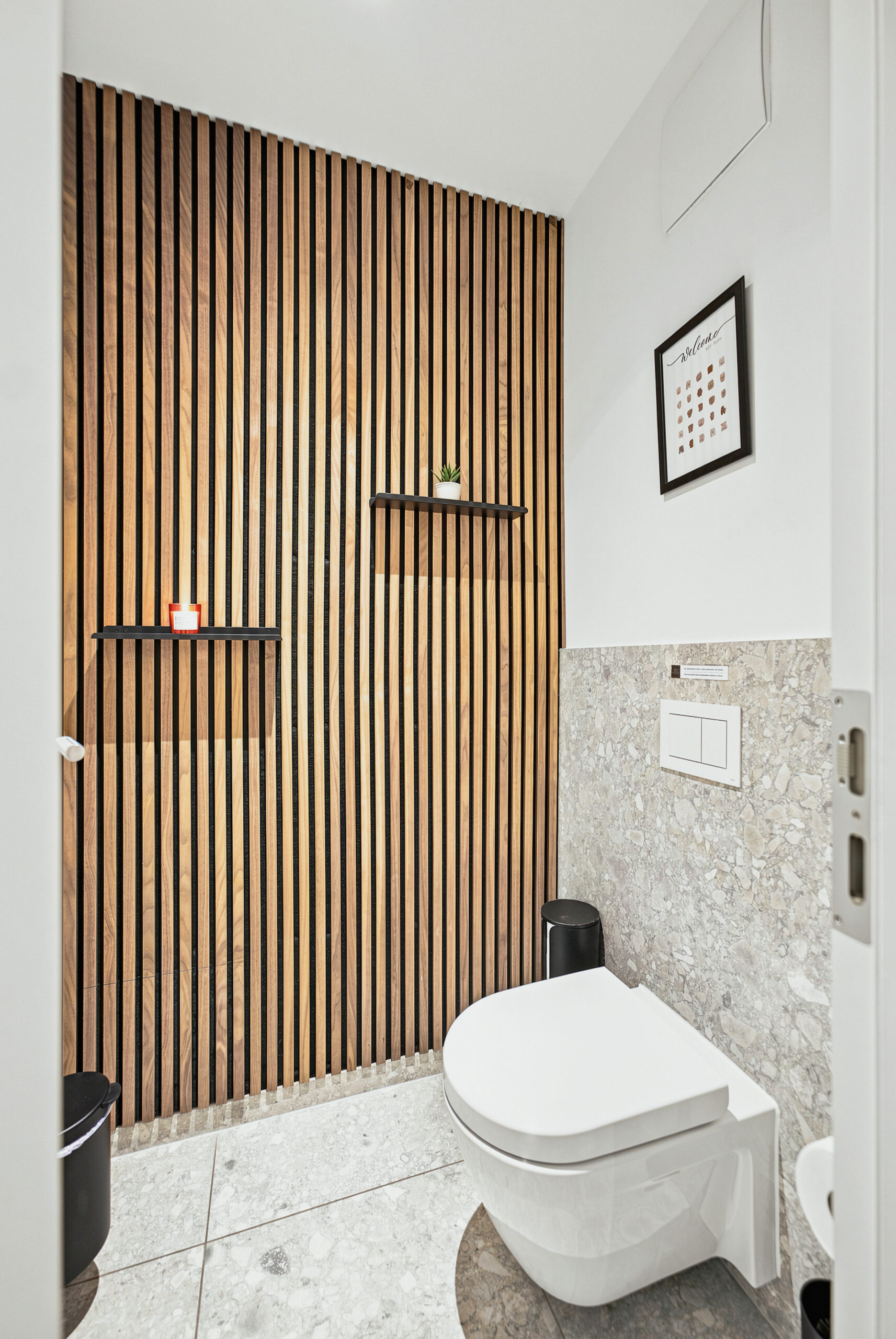 Modern toilet with wooden slat accent wall