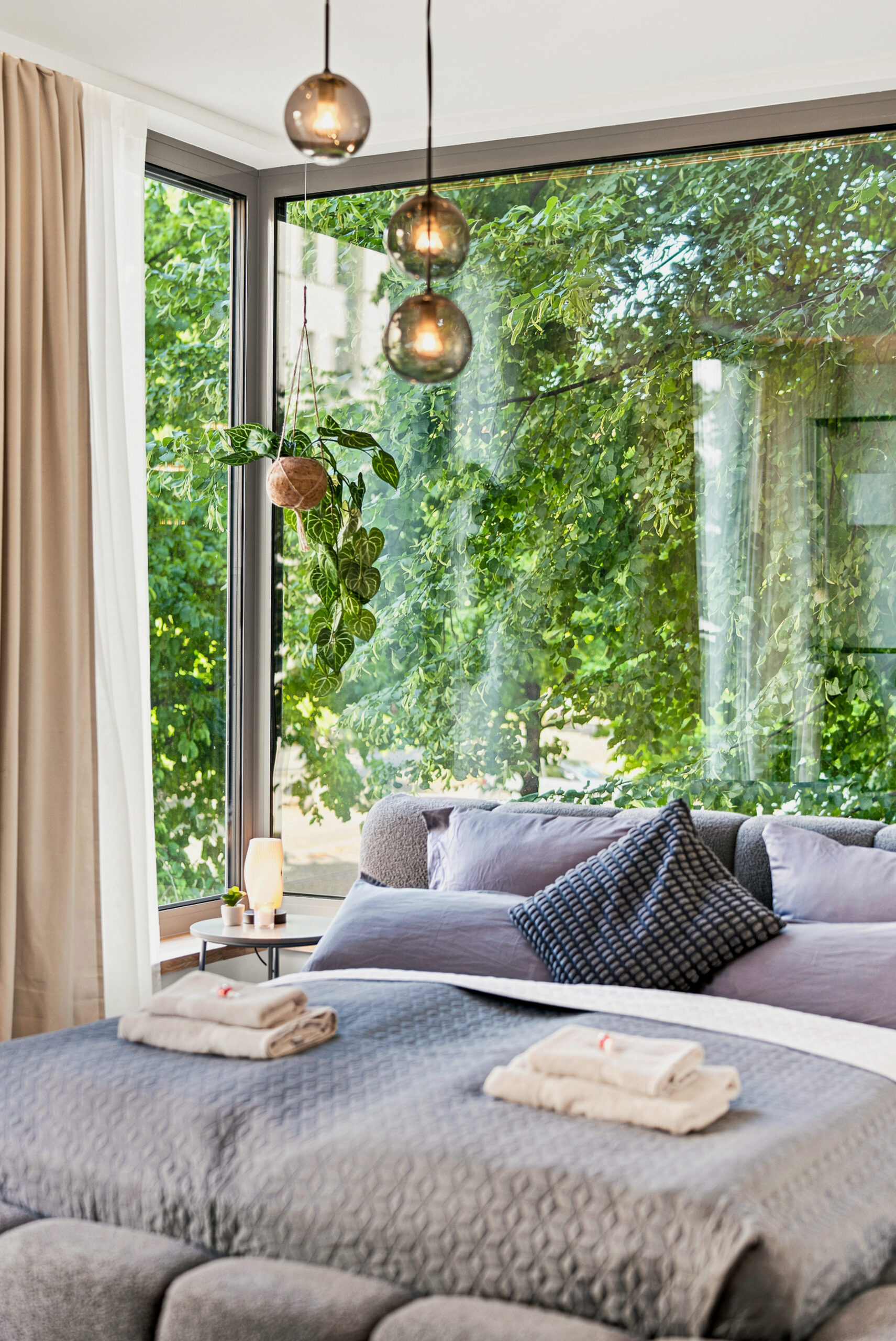 Bright seating nook with windows and pendant lights