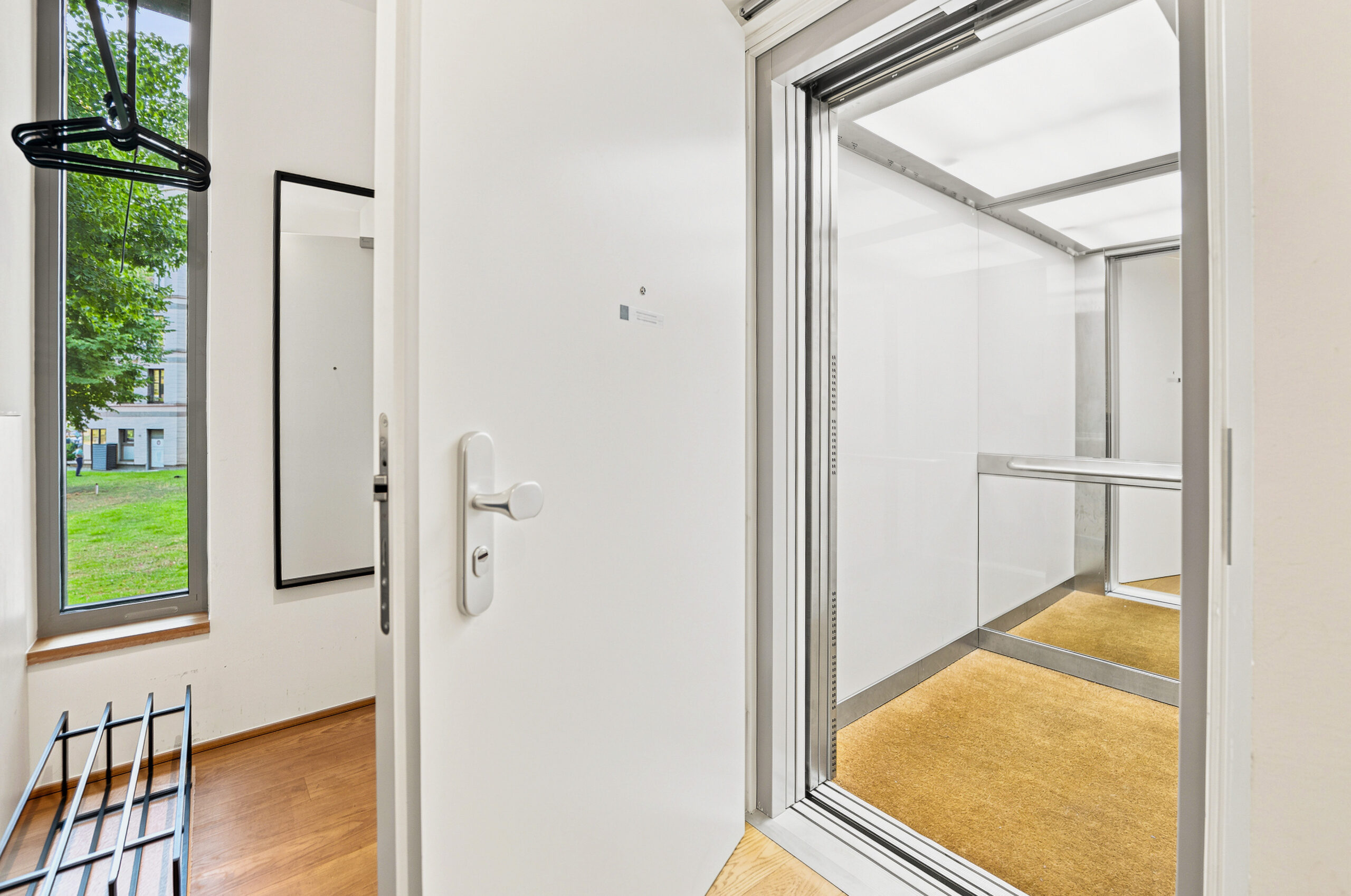 Bright entry hallway with door and window