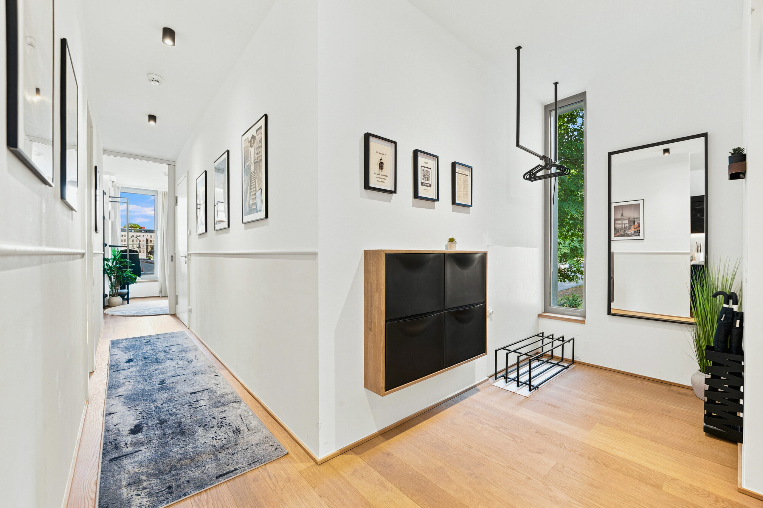 Contemporary living room with TV and wooden flooring