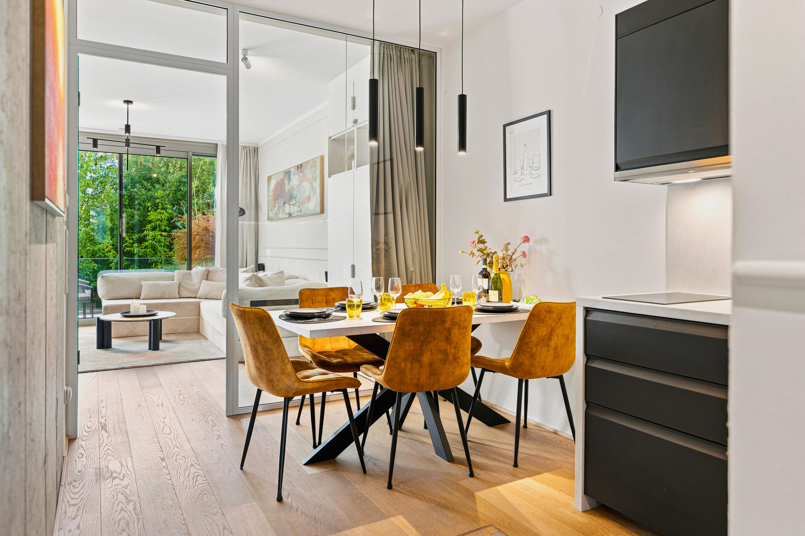 Modern kitchen with dining table and yellow chairs