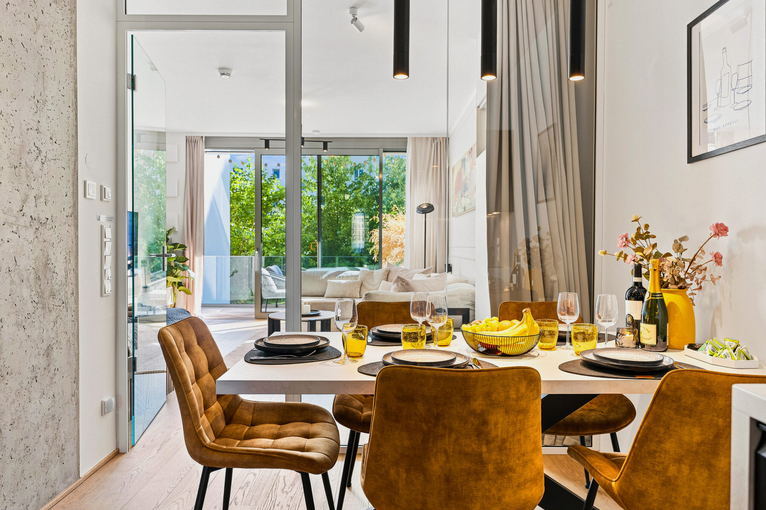 Bright dining area with glass doors, table, and natural light