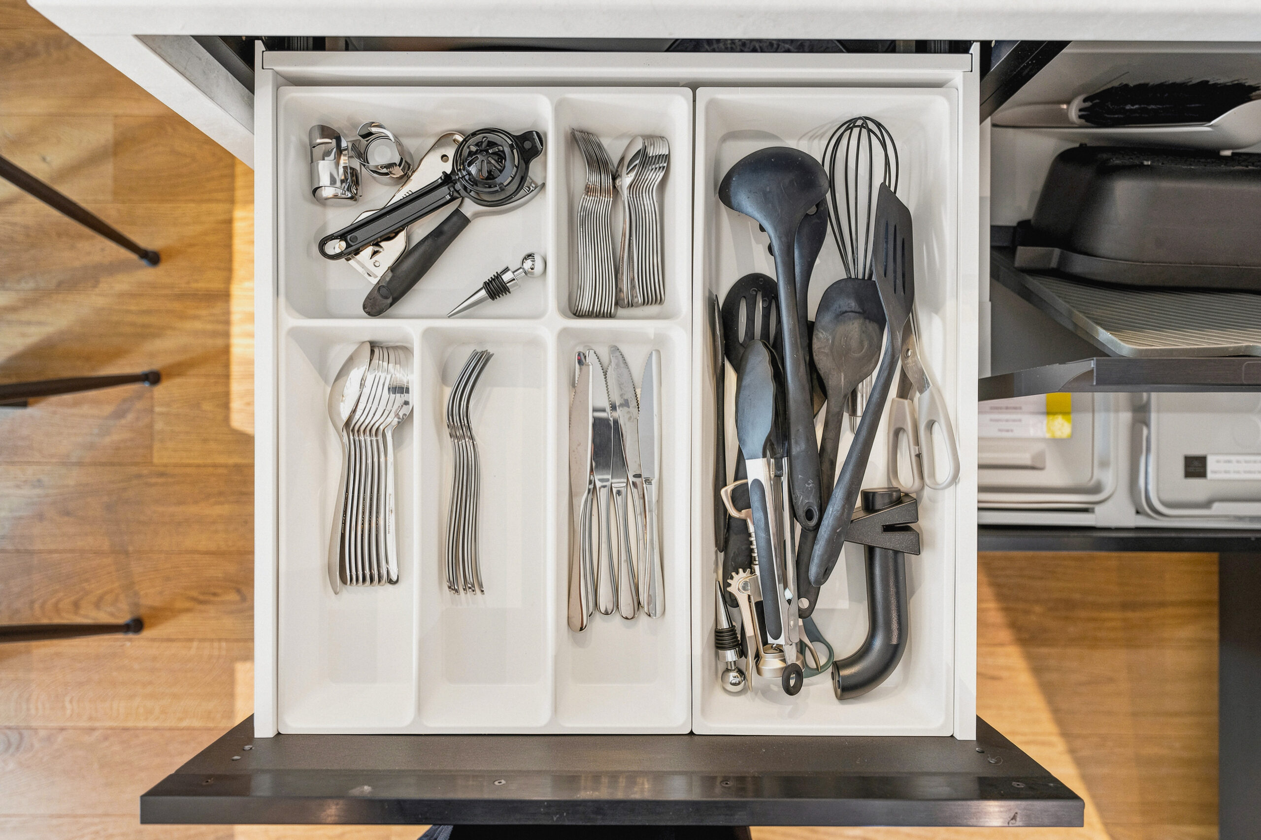 Drawer detail showing organized utensils and kitchen tools