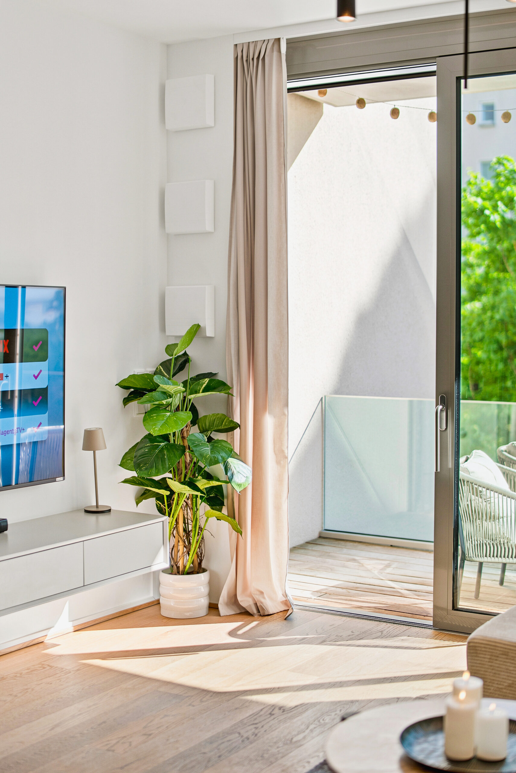 Bright balcony doorway with natural light and green views