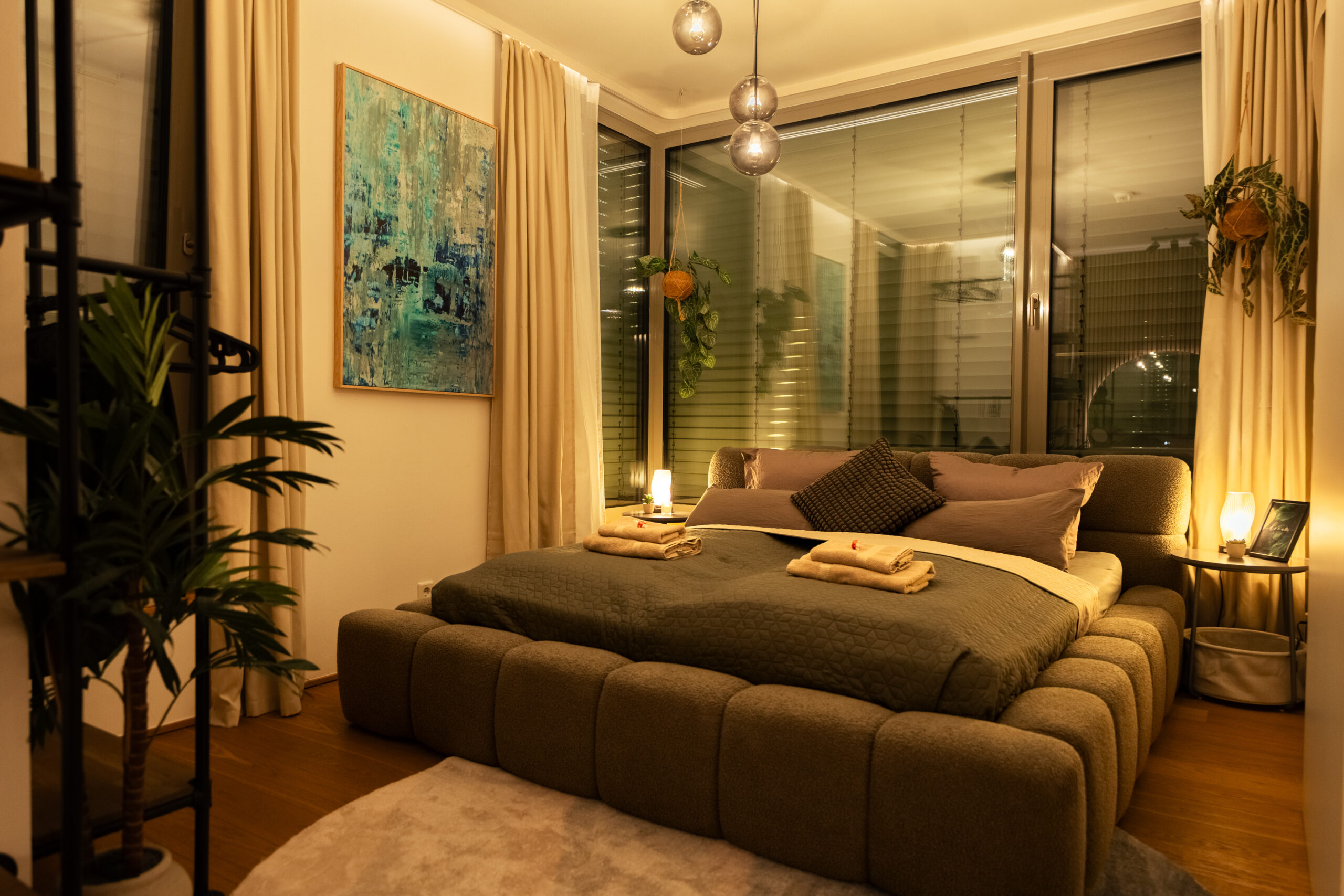 Cozy living room with beige sofa and accent lighting