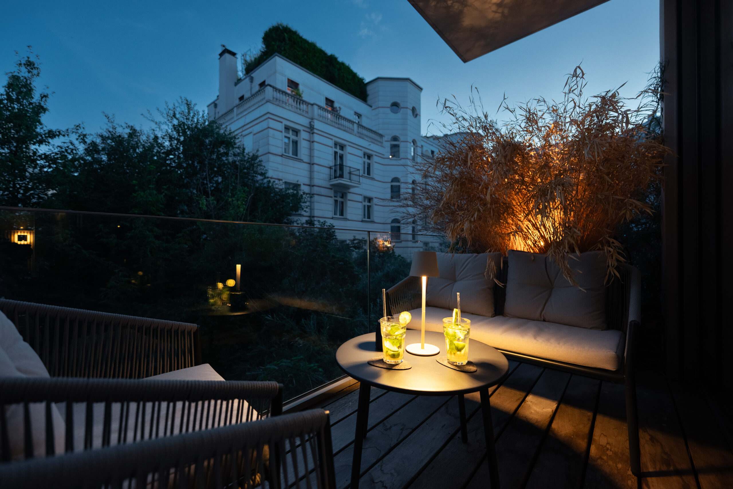 Rooftop seating area with city views and ambient lighting