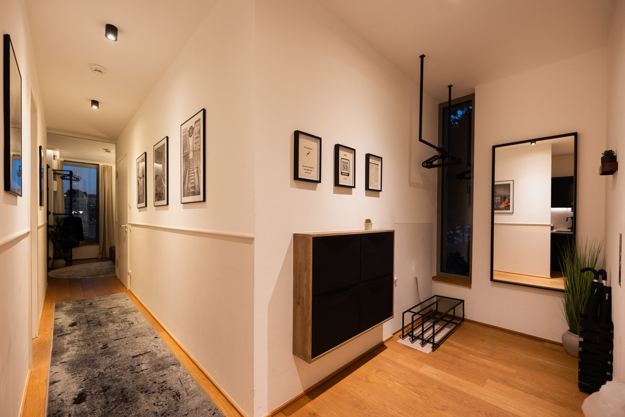 Modern hallway with wood flooring and contemporary decor