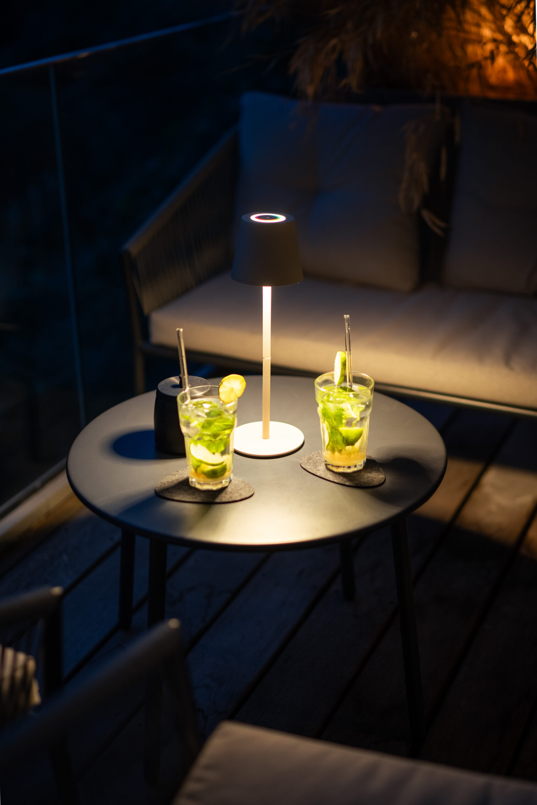 Intimate outdoor seating area with table and ambient candles