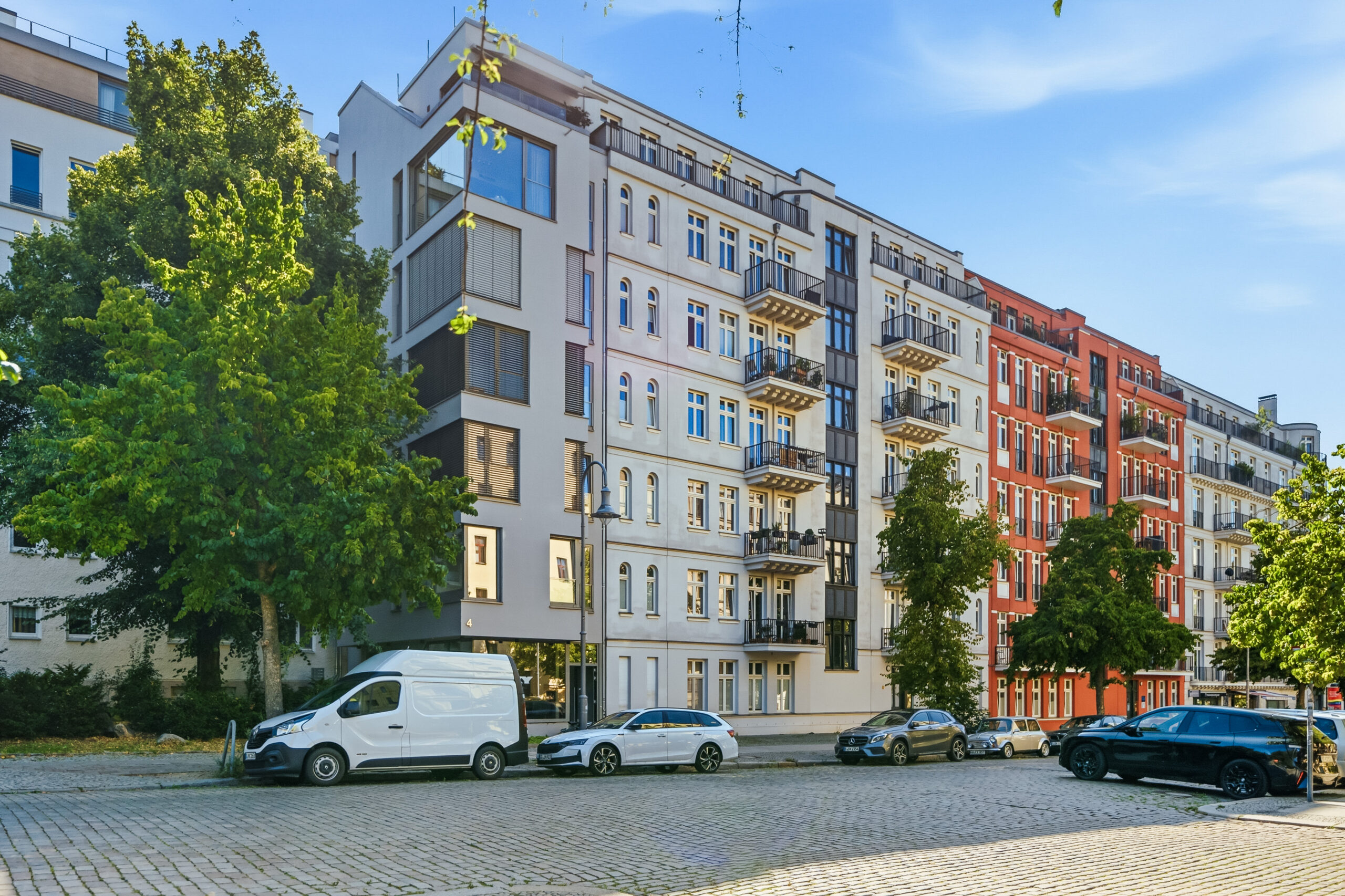Urban apartment complex with mixed facade materials and street