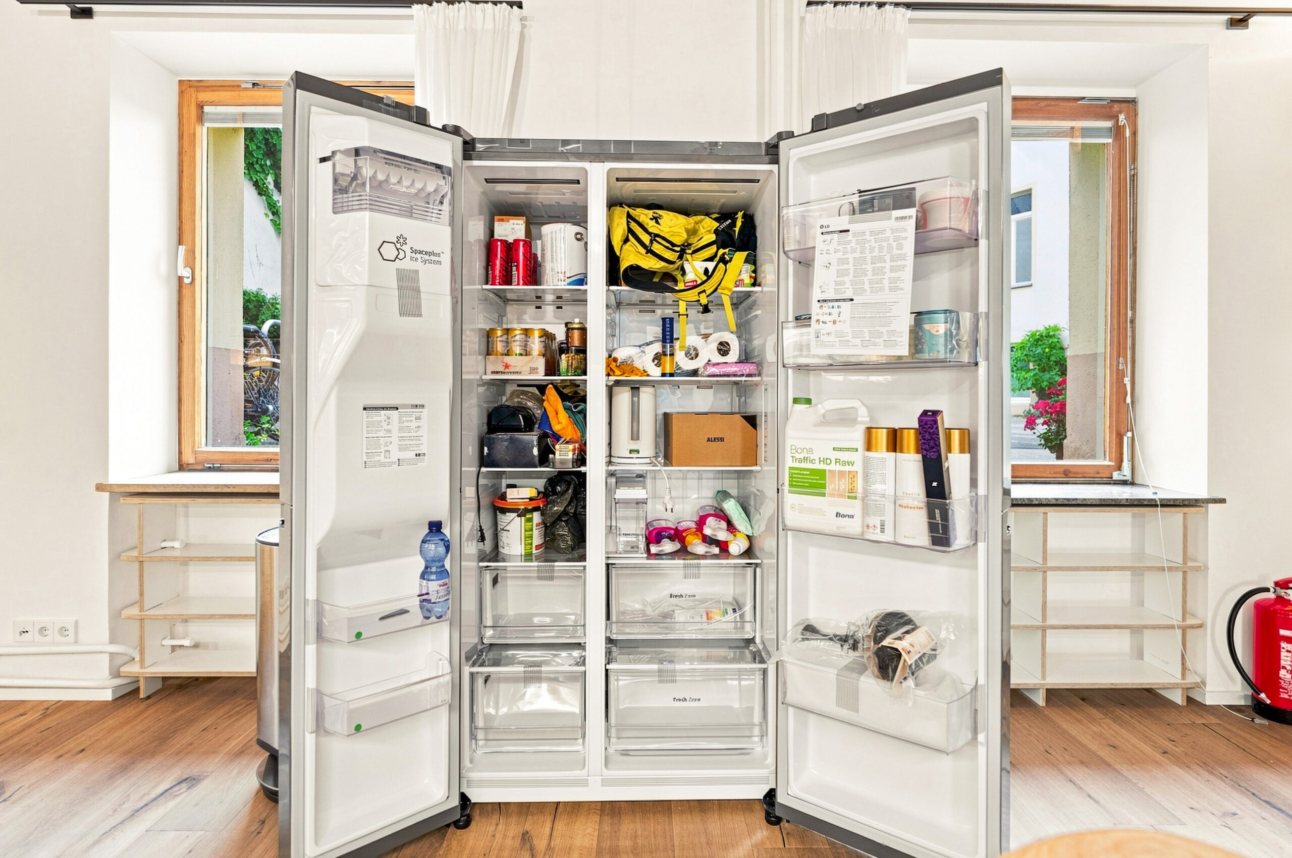 Open refrigerator showing fully stocked shelves and storage