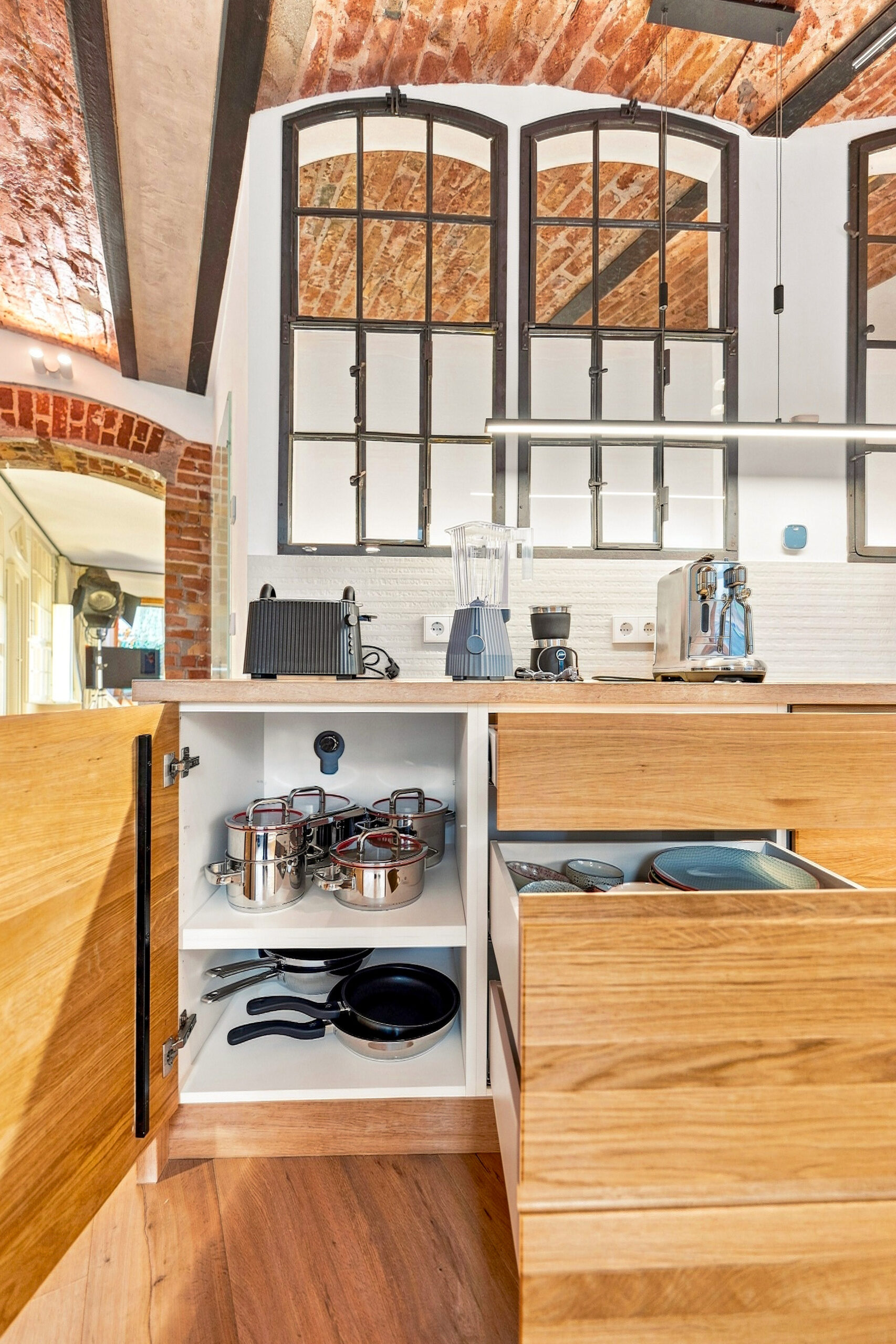 Kitchen detail showing organized drawers and cookware storage system