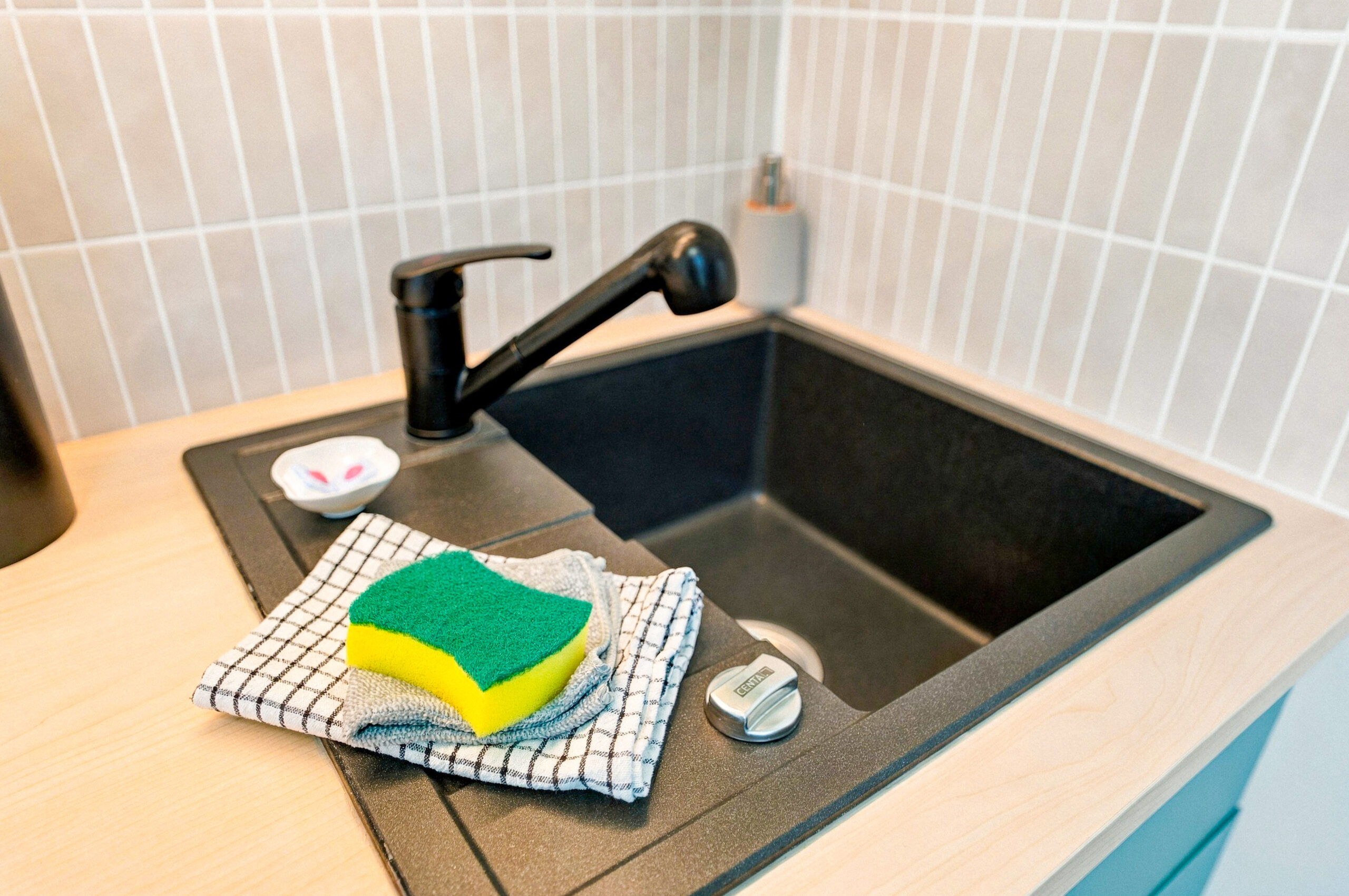 Sink with sponge and cloth close-up