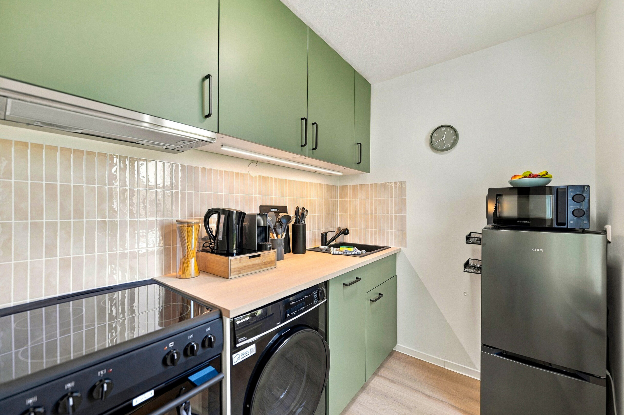Green cabinet kitchen with appliances