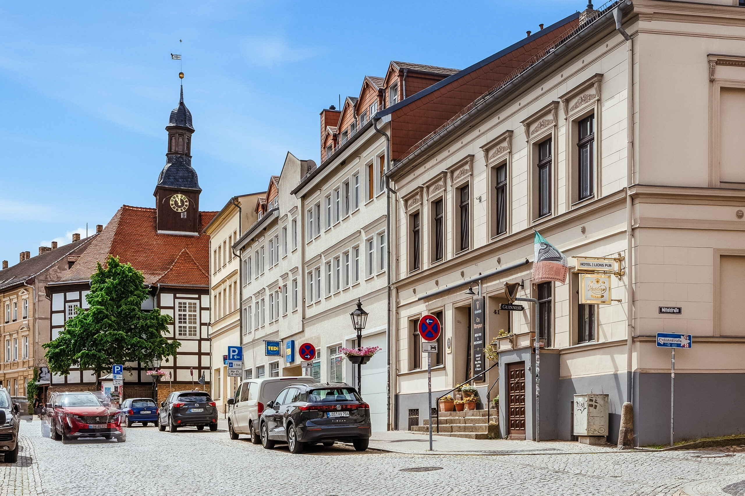 Street view with historic buildings and church tower