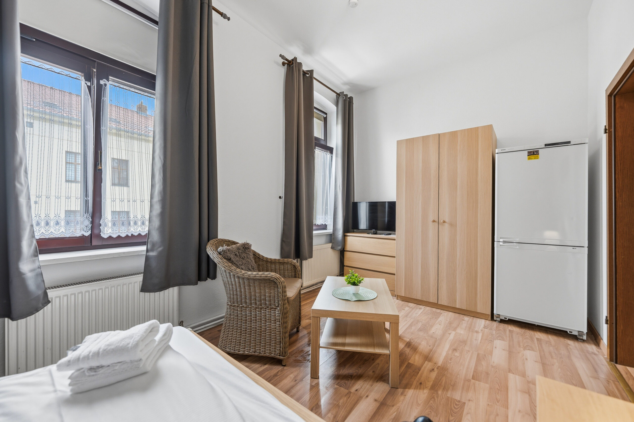 Bedroom with wardrobe, chair and small table