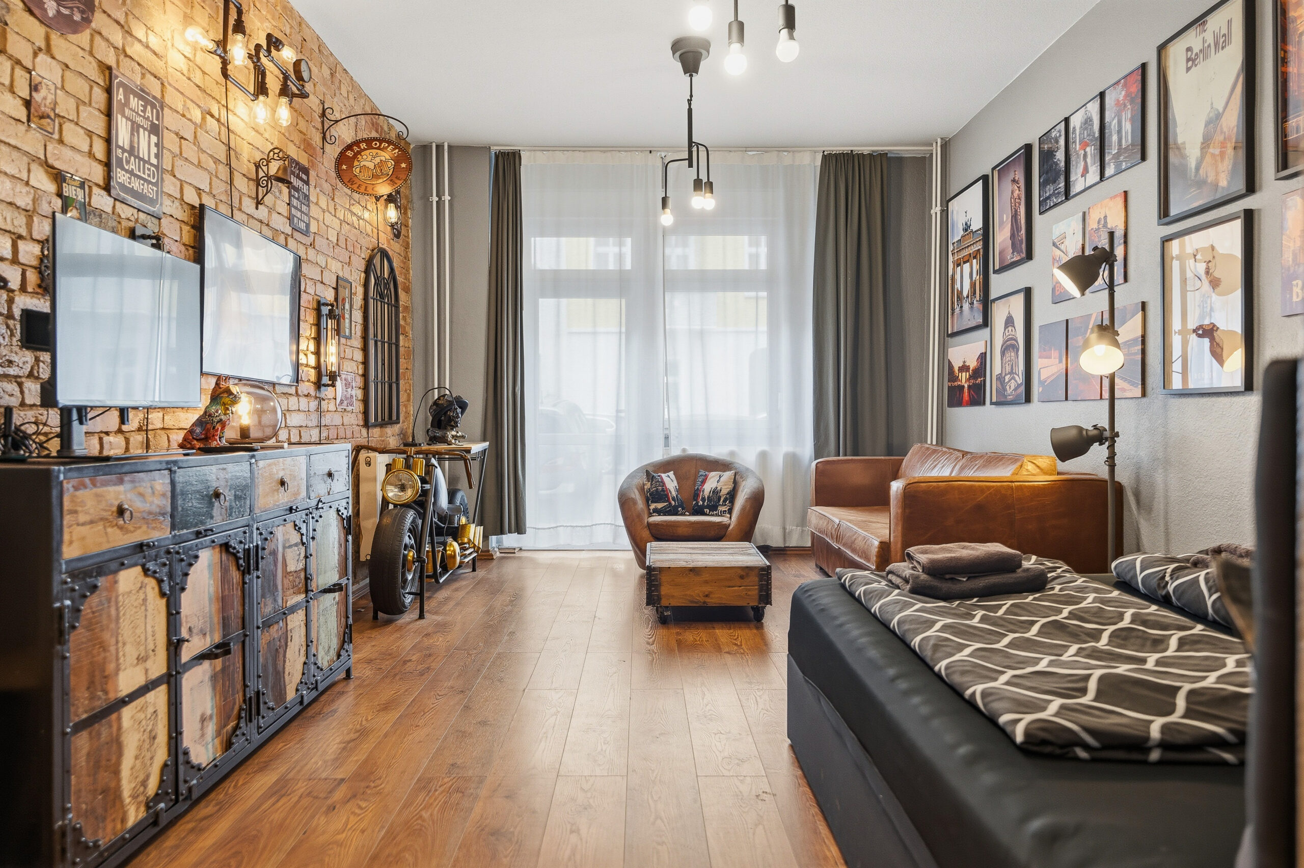 Wide view of industrial-style living room with sofas