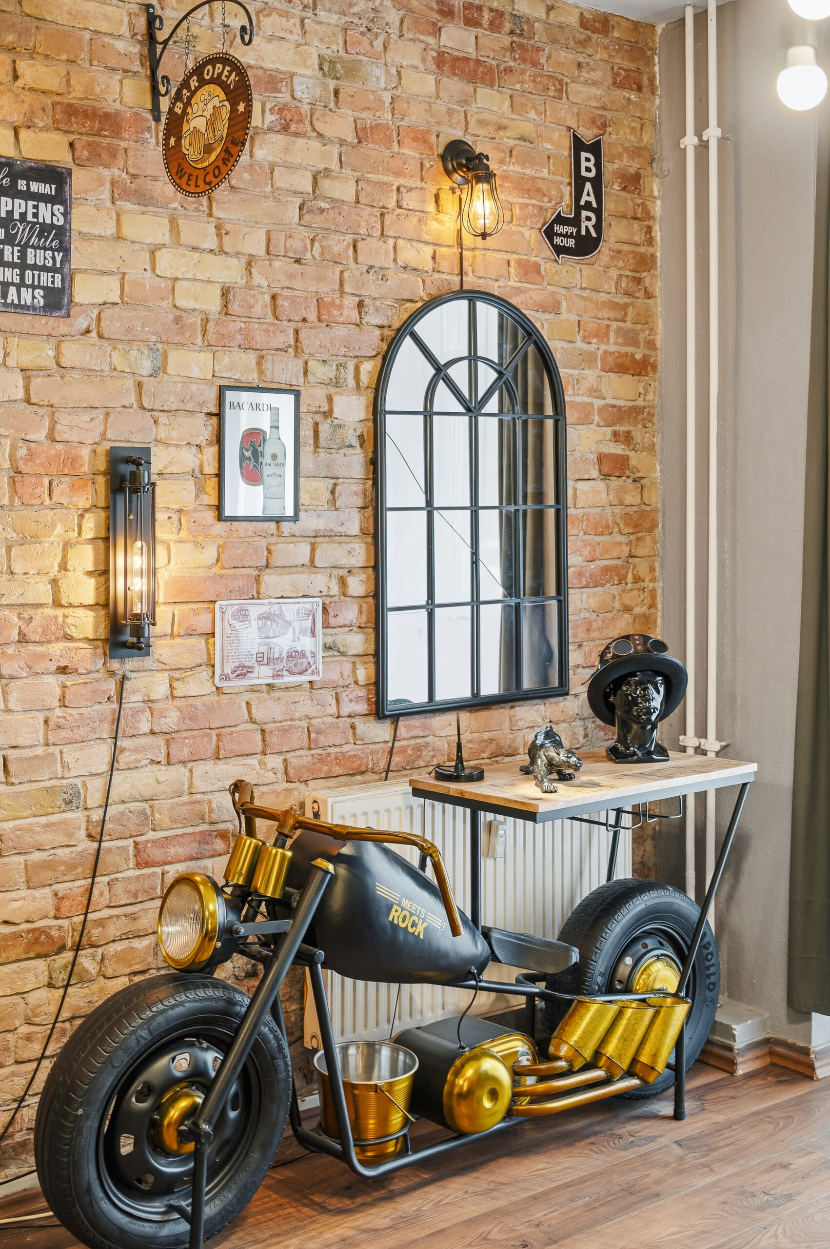 Decorative motorcycle sculpture against exposed brick wall