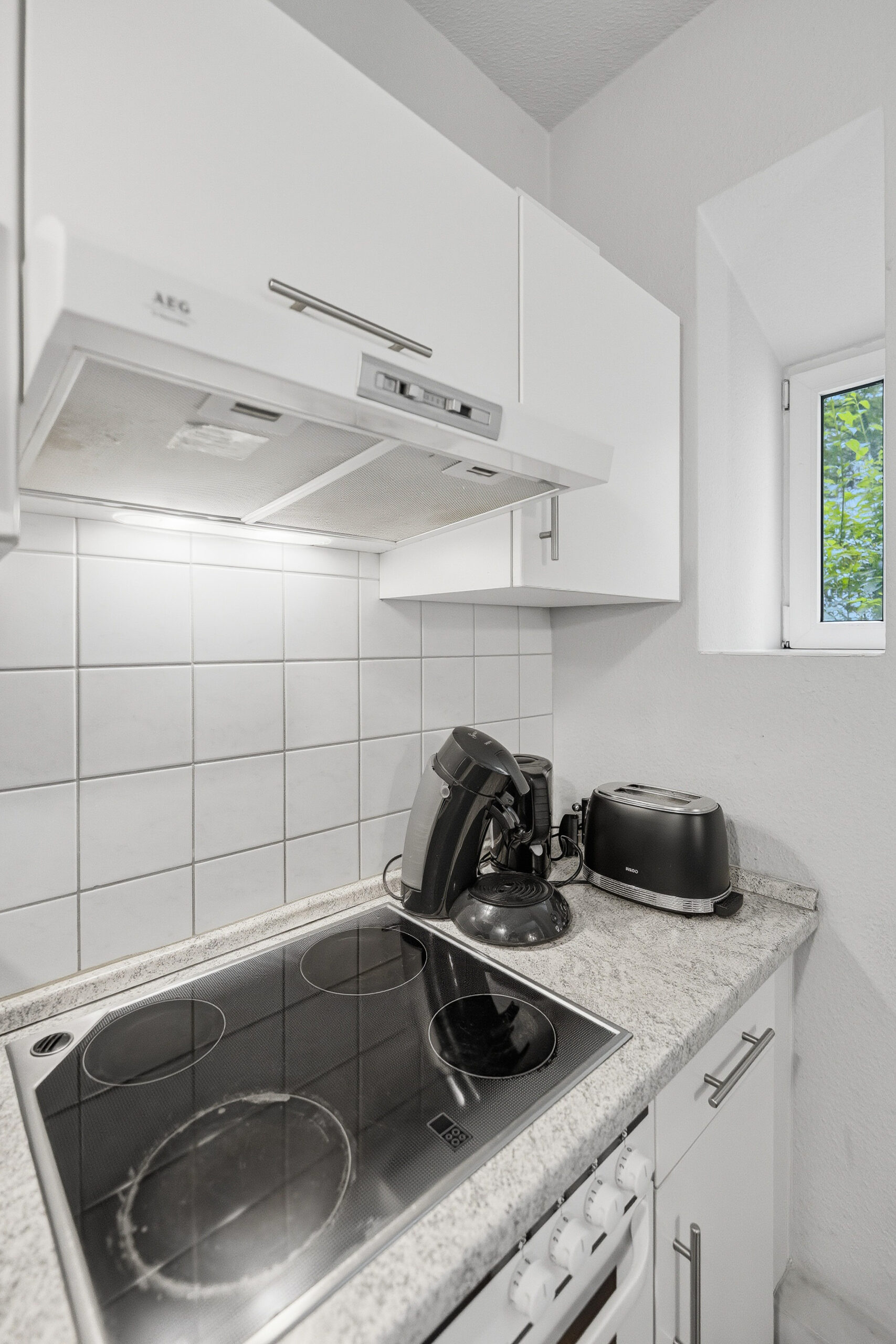 Kitchen countertop with stovetop and toaster