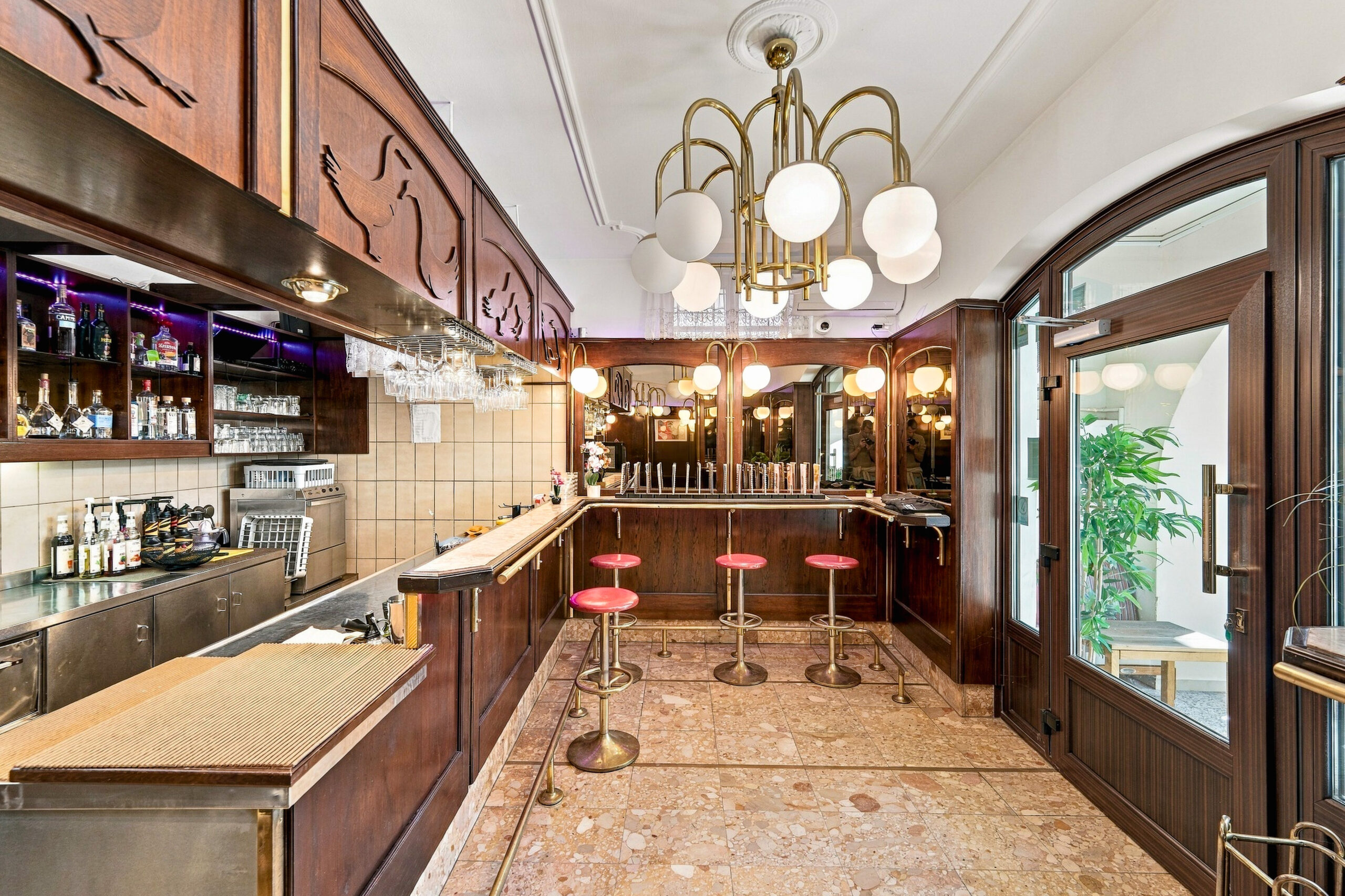 Elegant bar with chandelier and bar stools