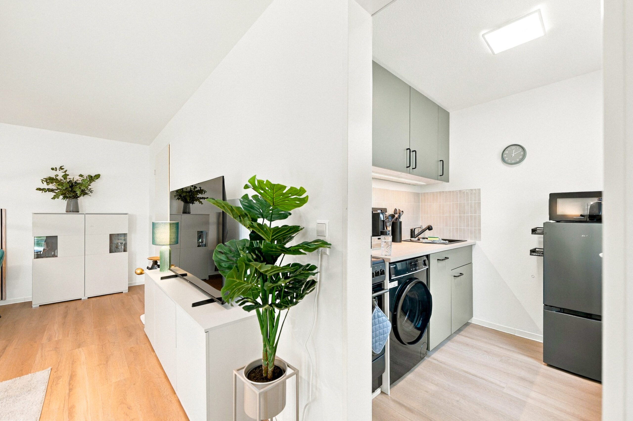 Hallway view into kitchen with appliances