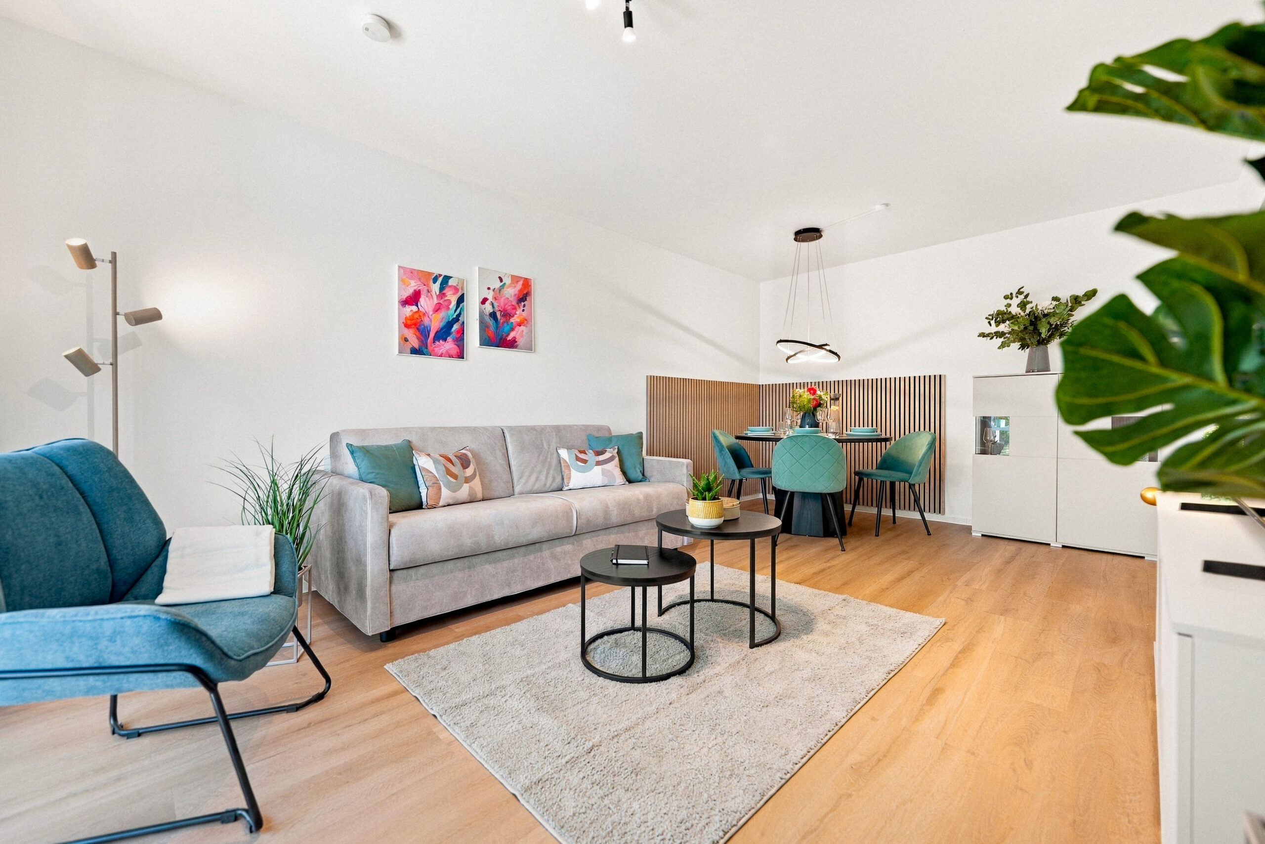 Living room with sofa, chairs and dining area