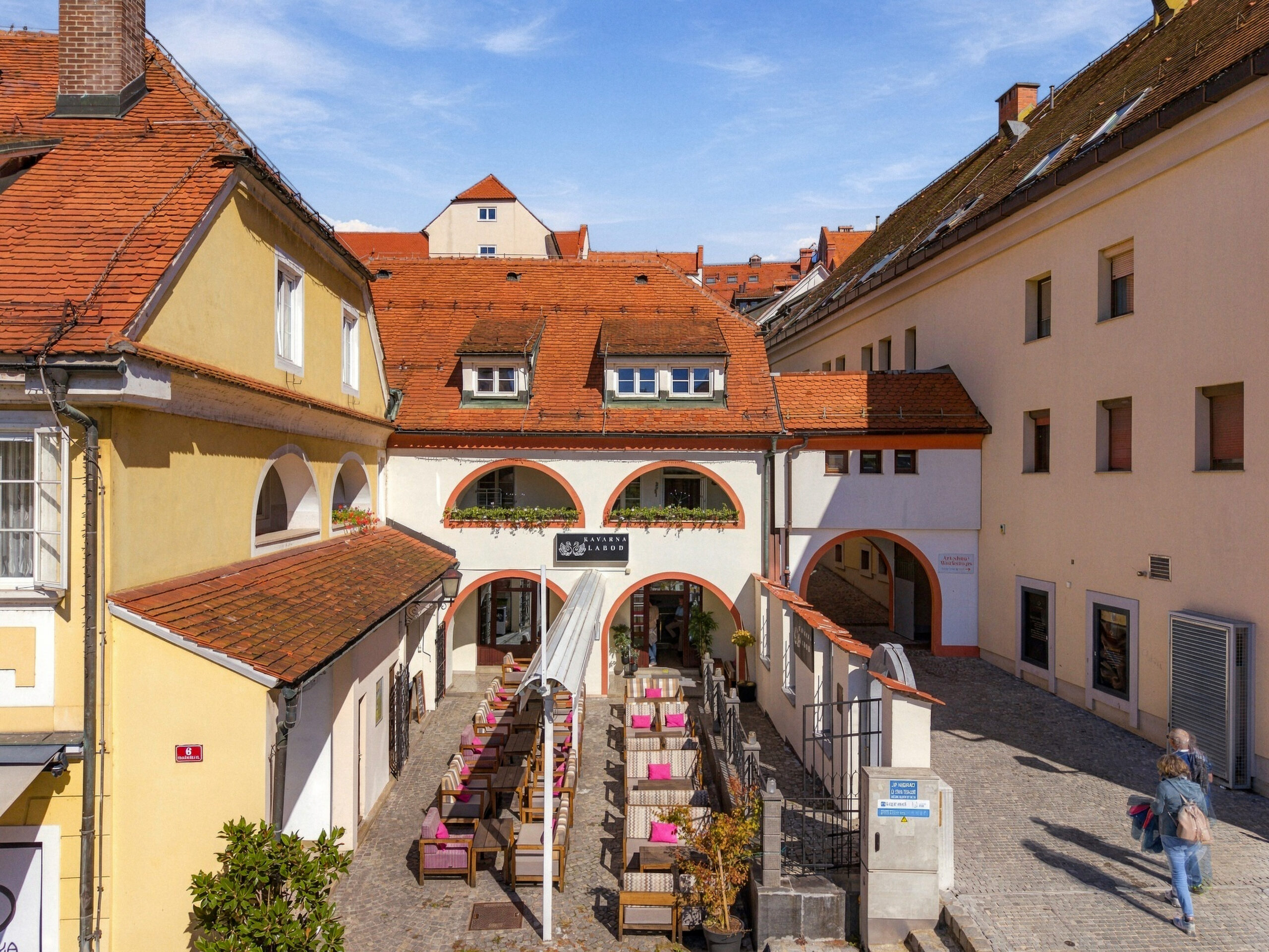 Aerial view of courtyard cafe and rooftops