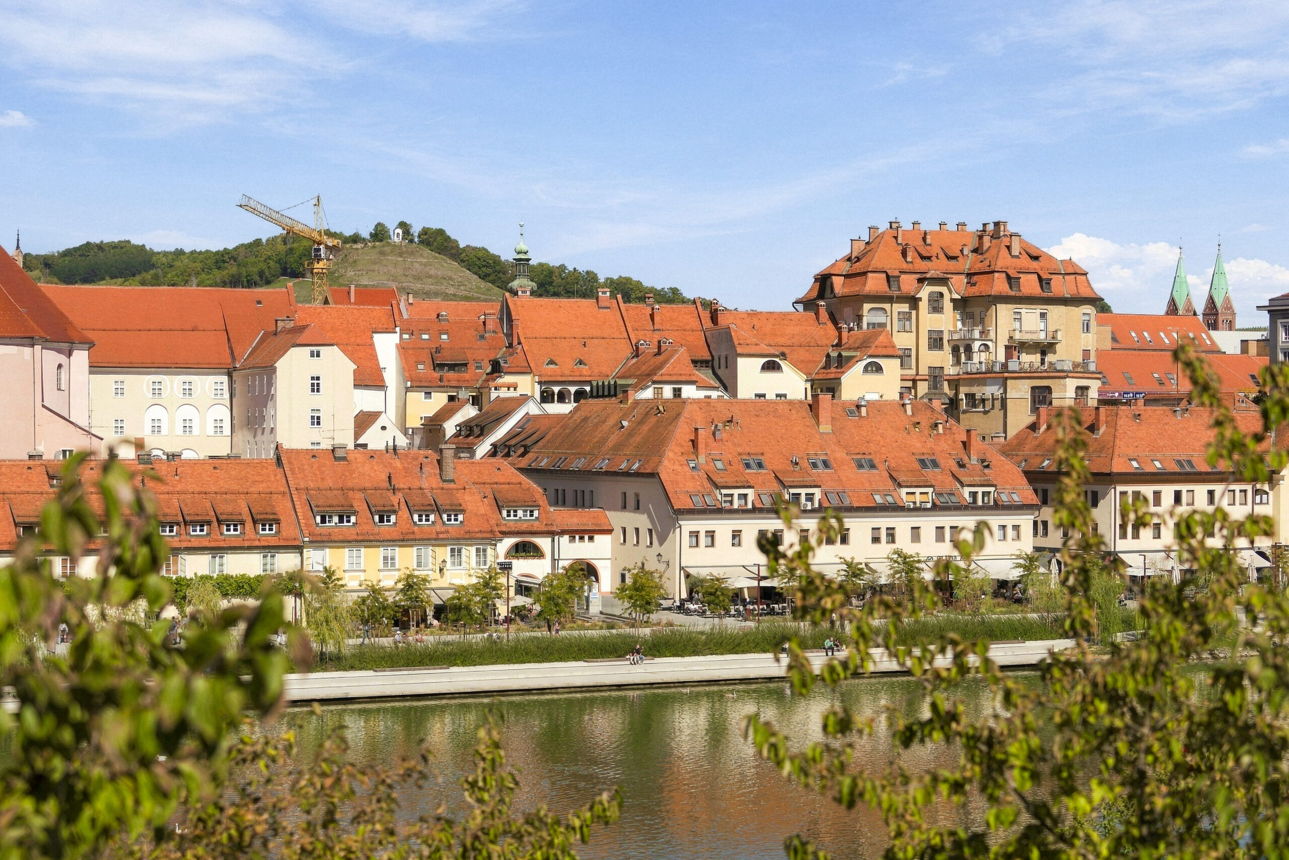 Riverside town view with hilltop castle