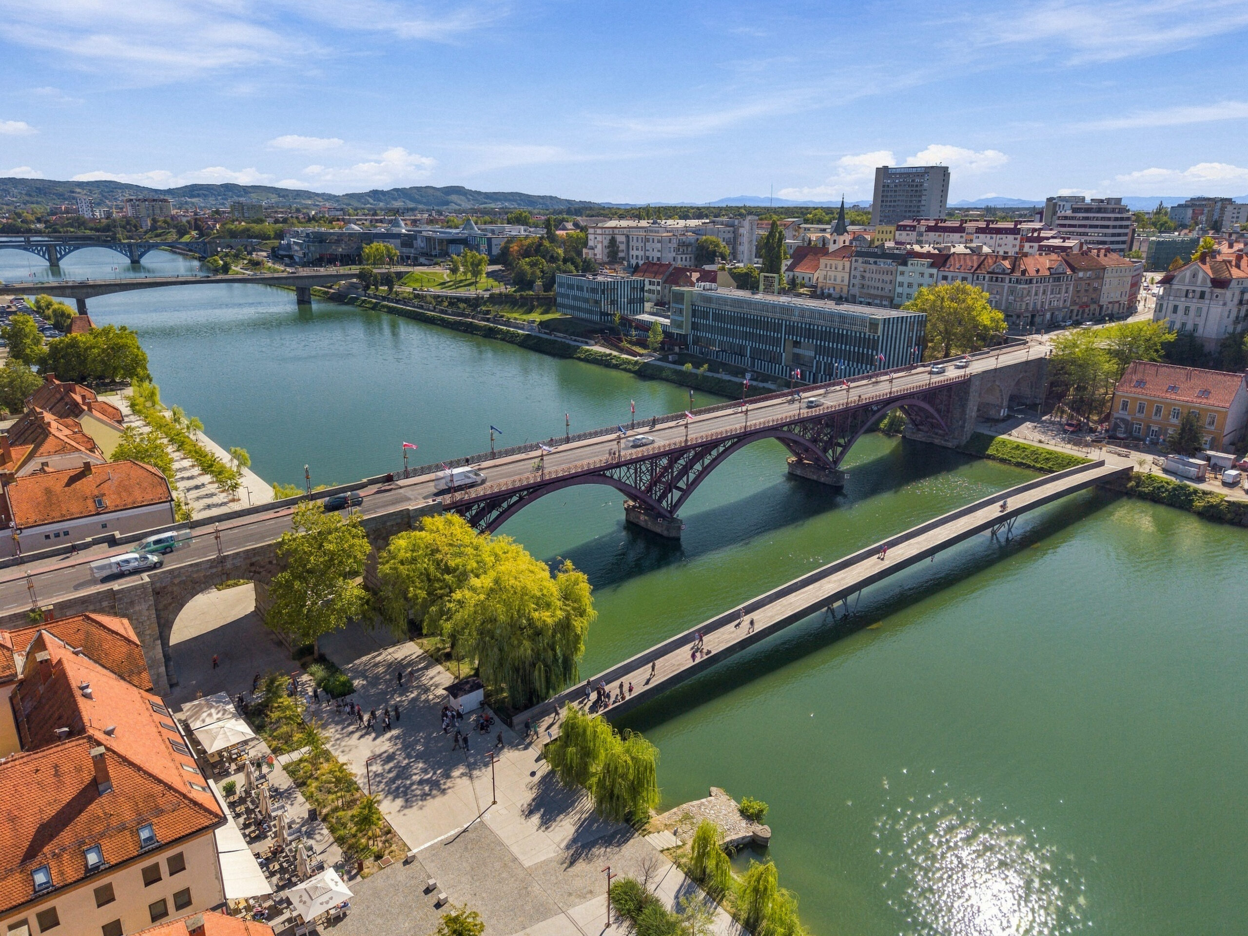 Aerial view of river with bridges and city skyline