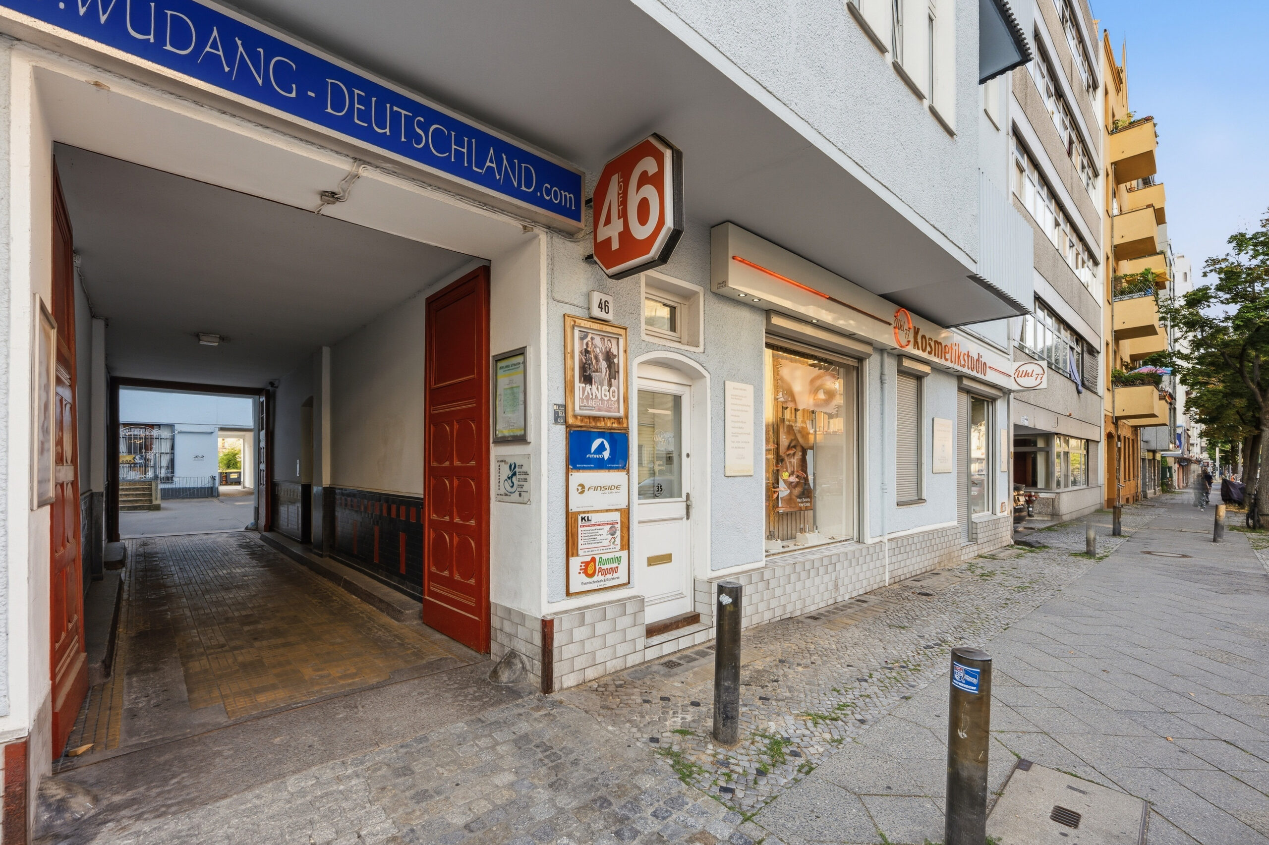 Ground floor storefront entrance on pedestrian street