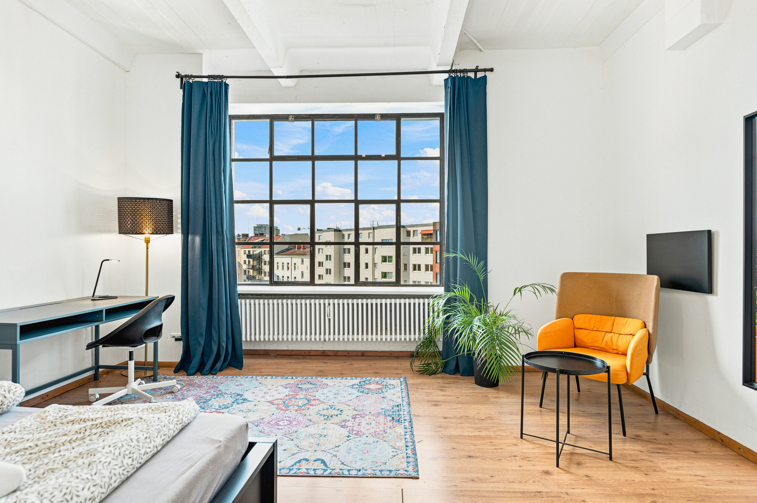 Modern bedroom with city view and minimalist décor
