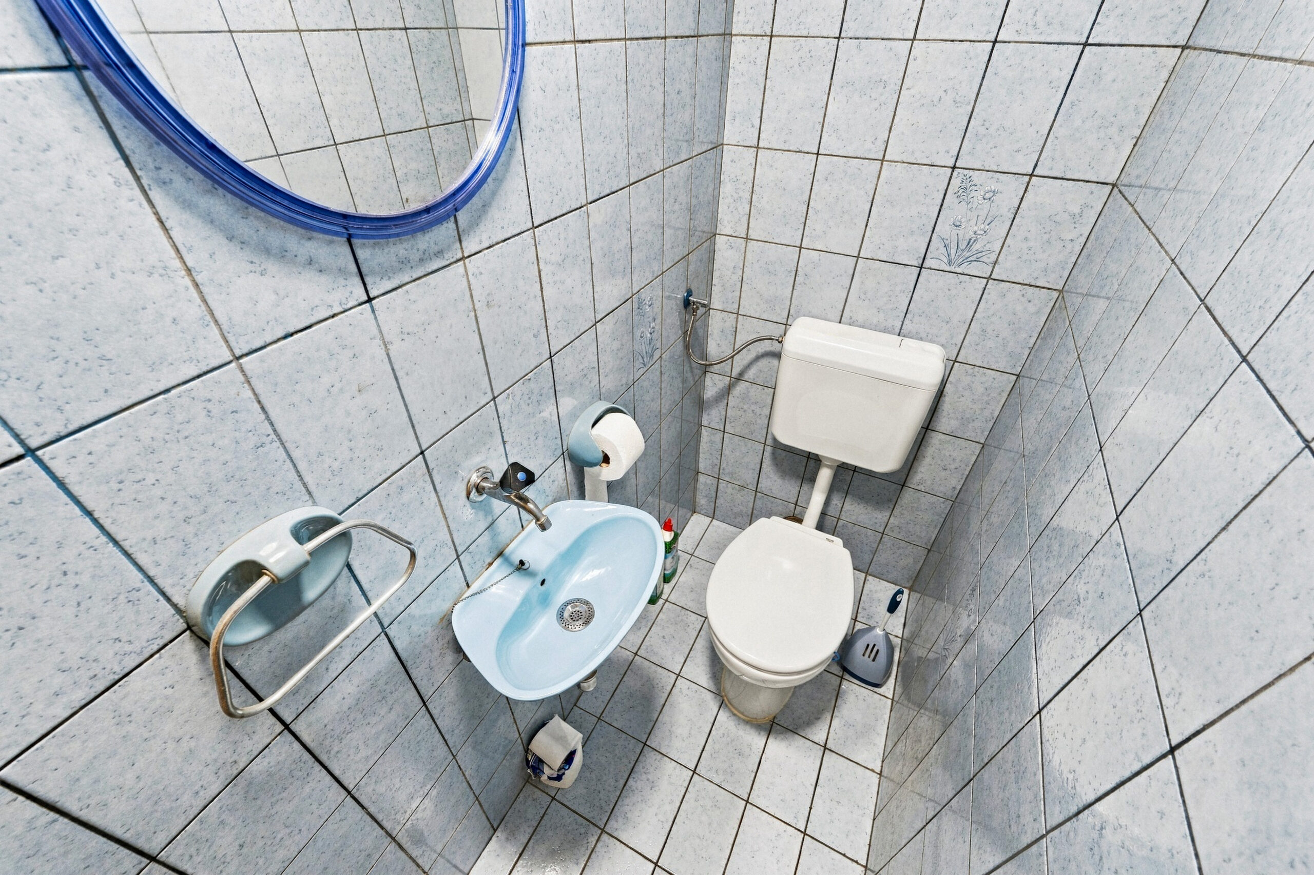 Small tiled bathroom with bidet and toilet