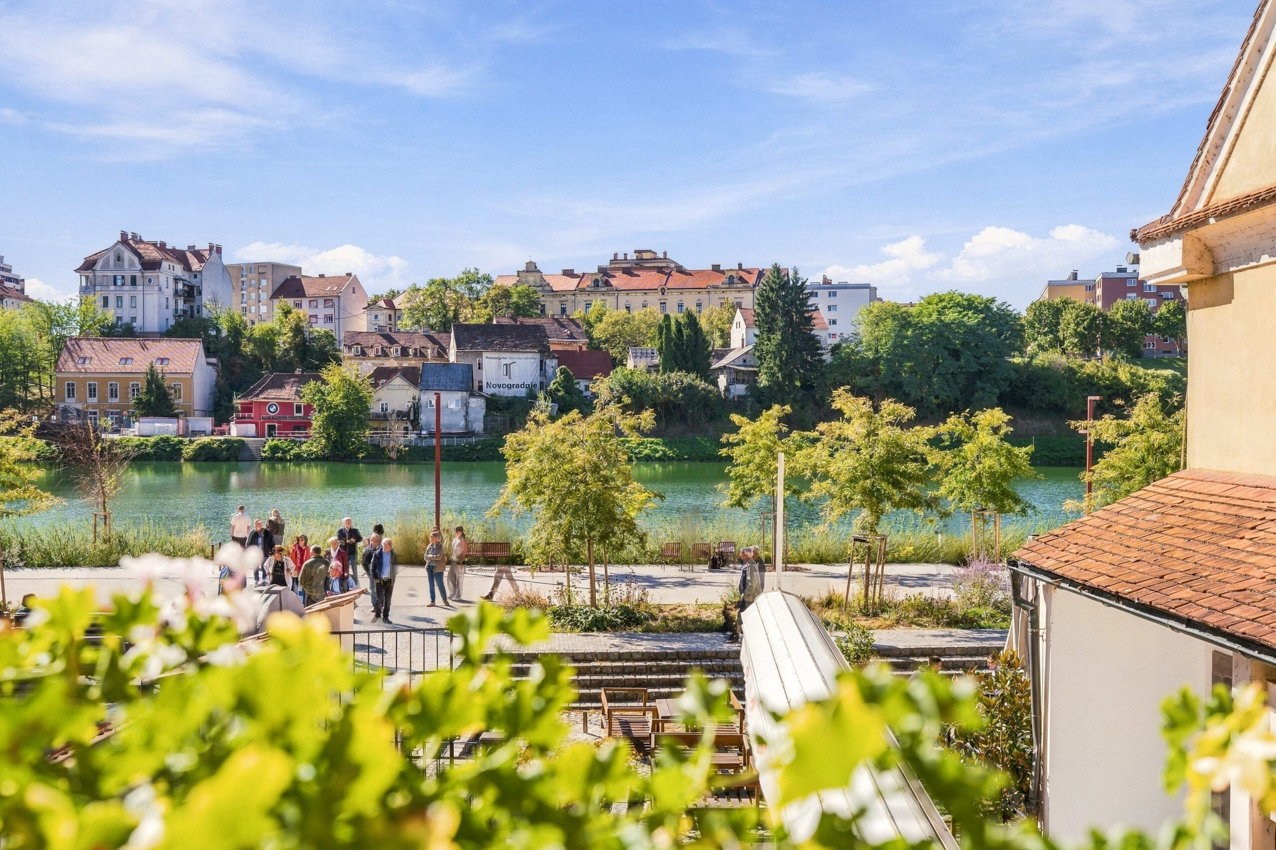 River view with people walking along terrace